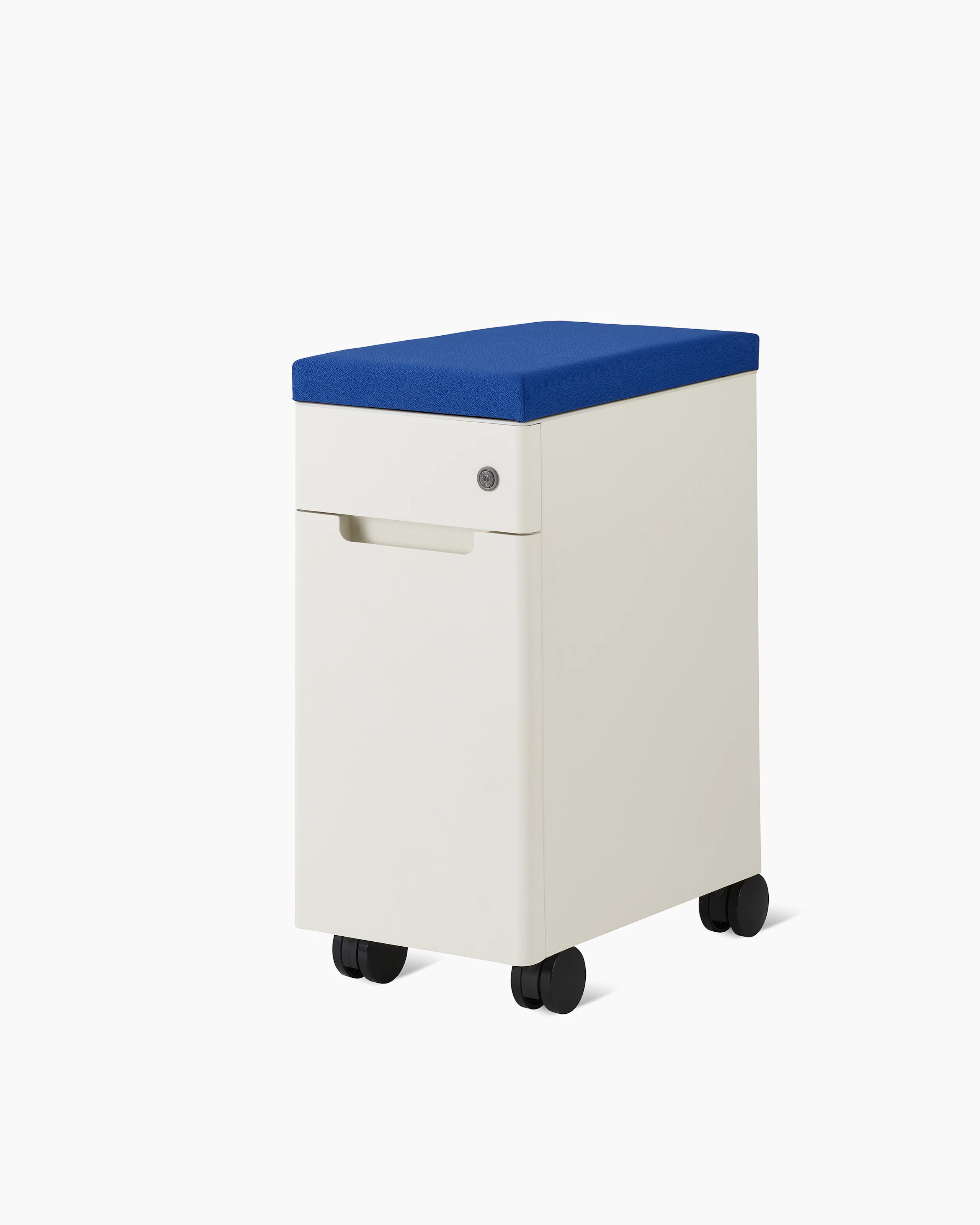 Slim, white storage pedestal on casters with a small drawer with lock, a clue cushion top, and door for storage.