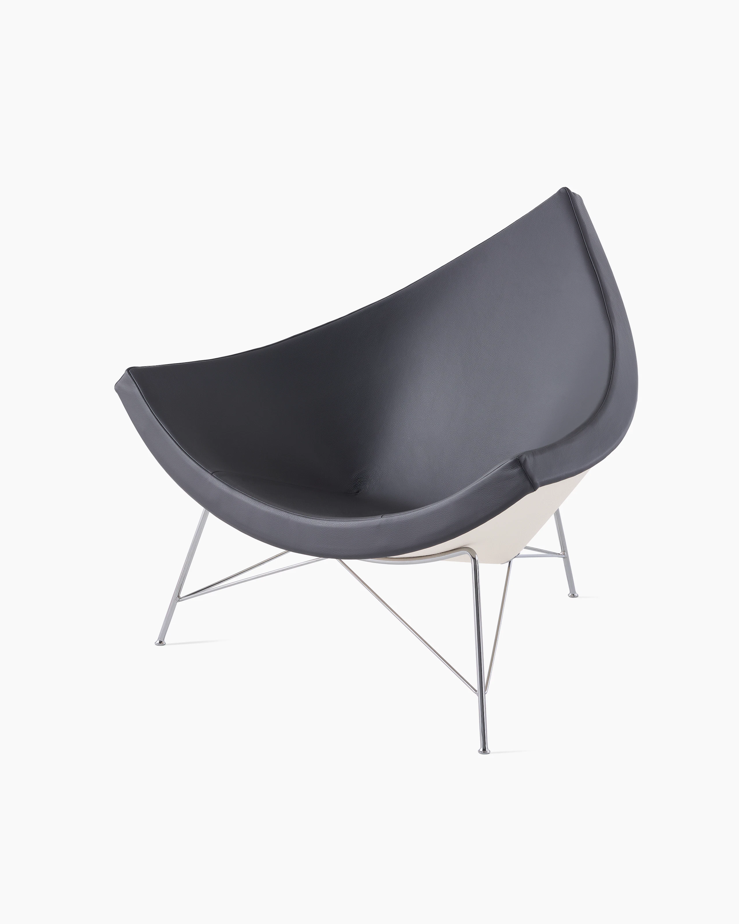 A dark grey leather Nelson Coconut Lounge Chair viewed from a 45-degree angle.