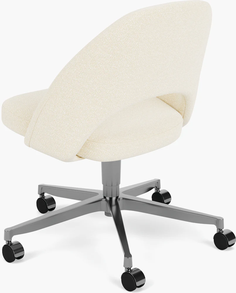 Blue upholstered office chair with chrome base in a home office