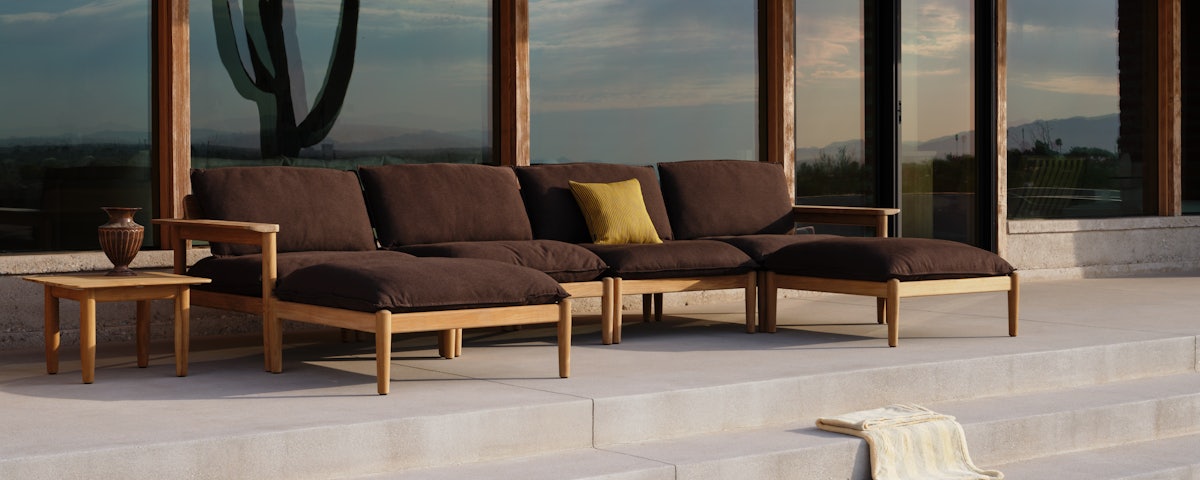 Terassi Double Chaise Sectional with Terassi Armless Single Seat Modules on an outdoor stepped patio