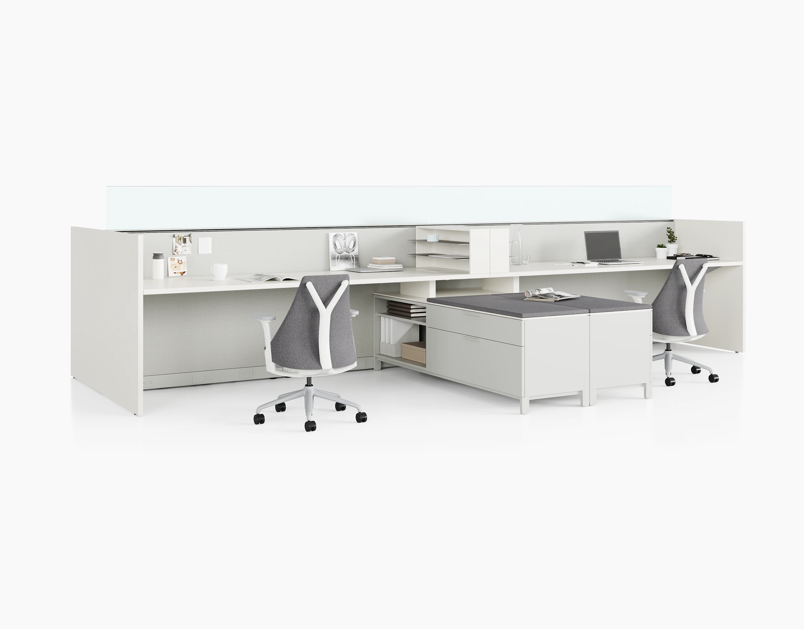 Two grey Canvas Wall workstations with lower storage, glass screens, and Sayl chairs.