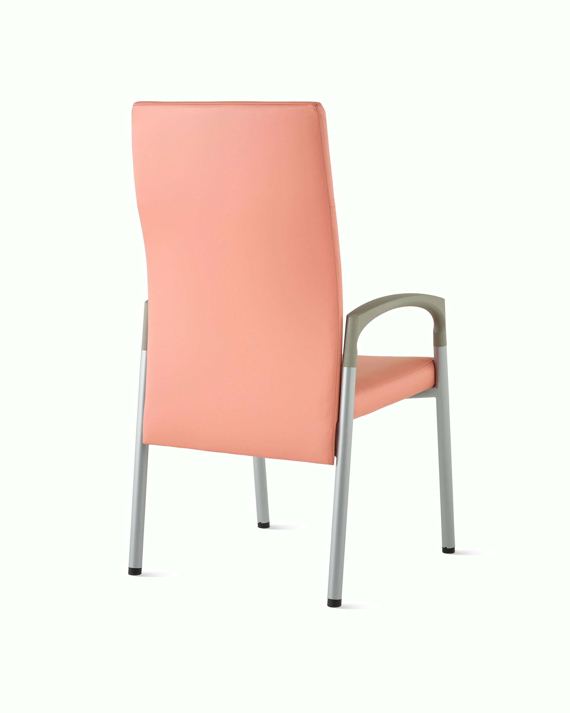 Three-quarter, back view of a high-back Valor patient chair in a salmon upholstery and silver frame with pewter armcaps.