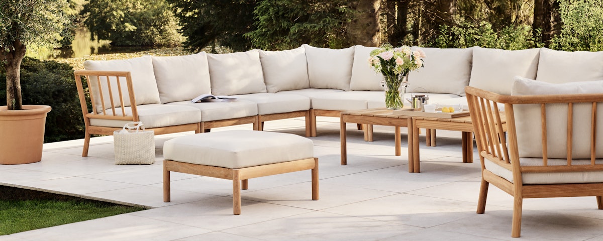 Tradition Outdoor Corner Module as part of an assembled sofa sectional in an outdoor patio setting