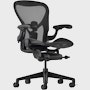 Black matte Aeron Chair on a white background with a 5-star base and ergonomic back support, angled view of the chair front.