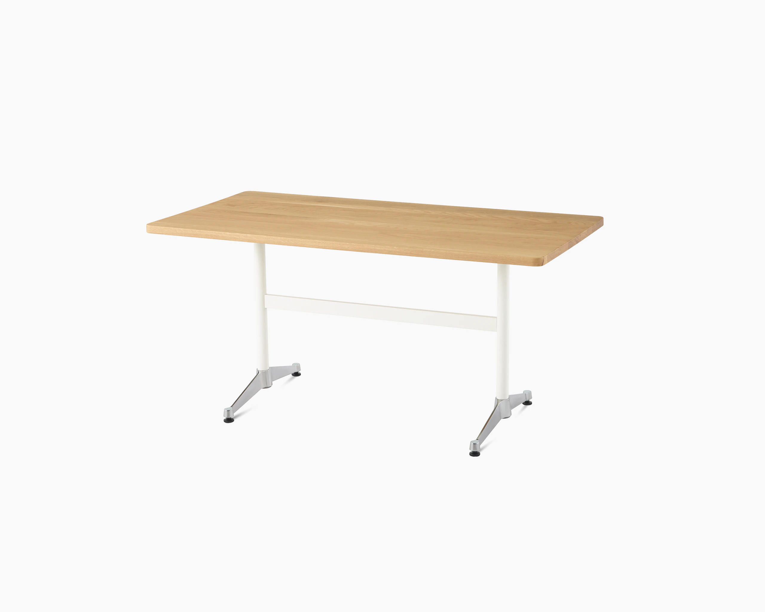 An oak Eames T-Leg Table with white legs and chrome feet.