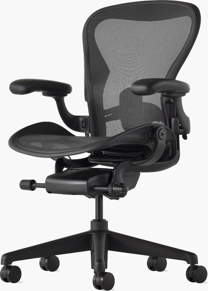 Black matte Aeron Chair on a white background with a 5-star base and ergonomic back support, angled view of the chair front.