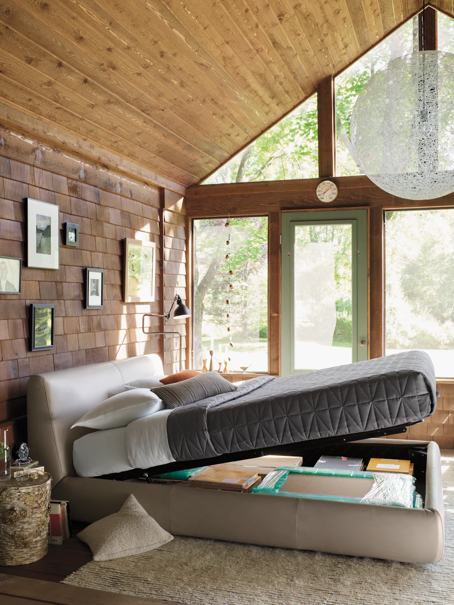 Modern bedroom with large bed and open dresser clutter, master bedroom scene