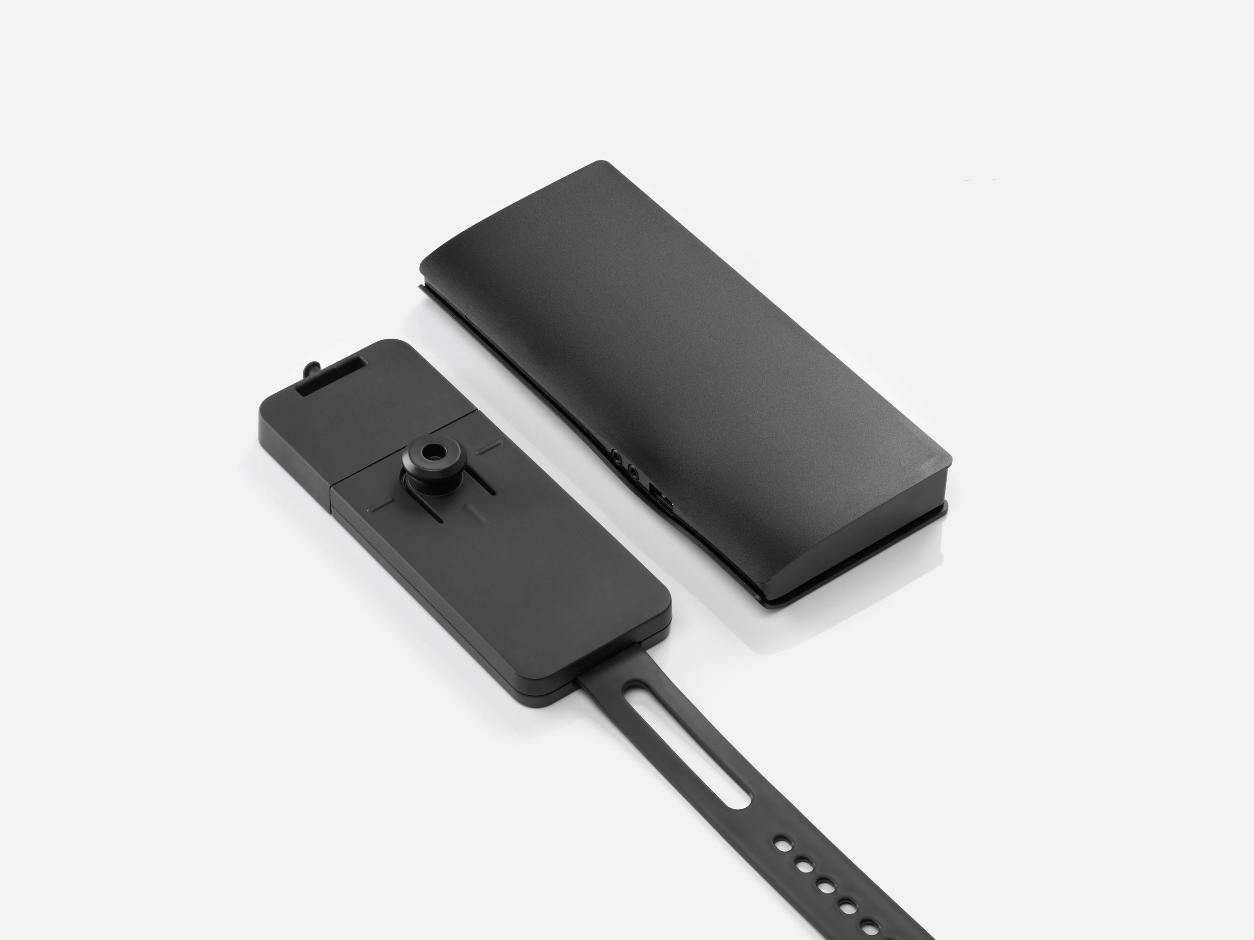 Loop Micro Mount with the adjustable strap shown next to an example thin client or power docking station.