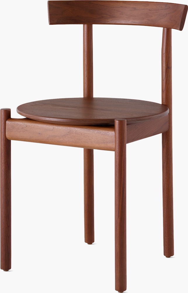 A walnut Comma Chair, viewed from the front at an angle.