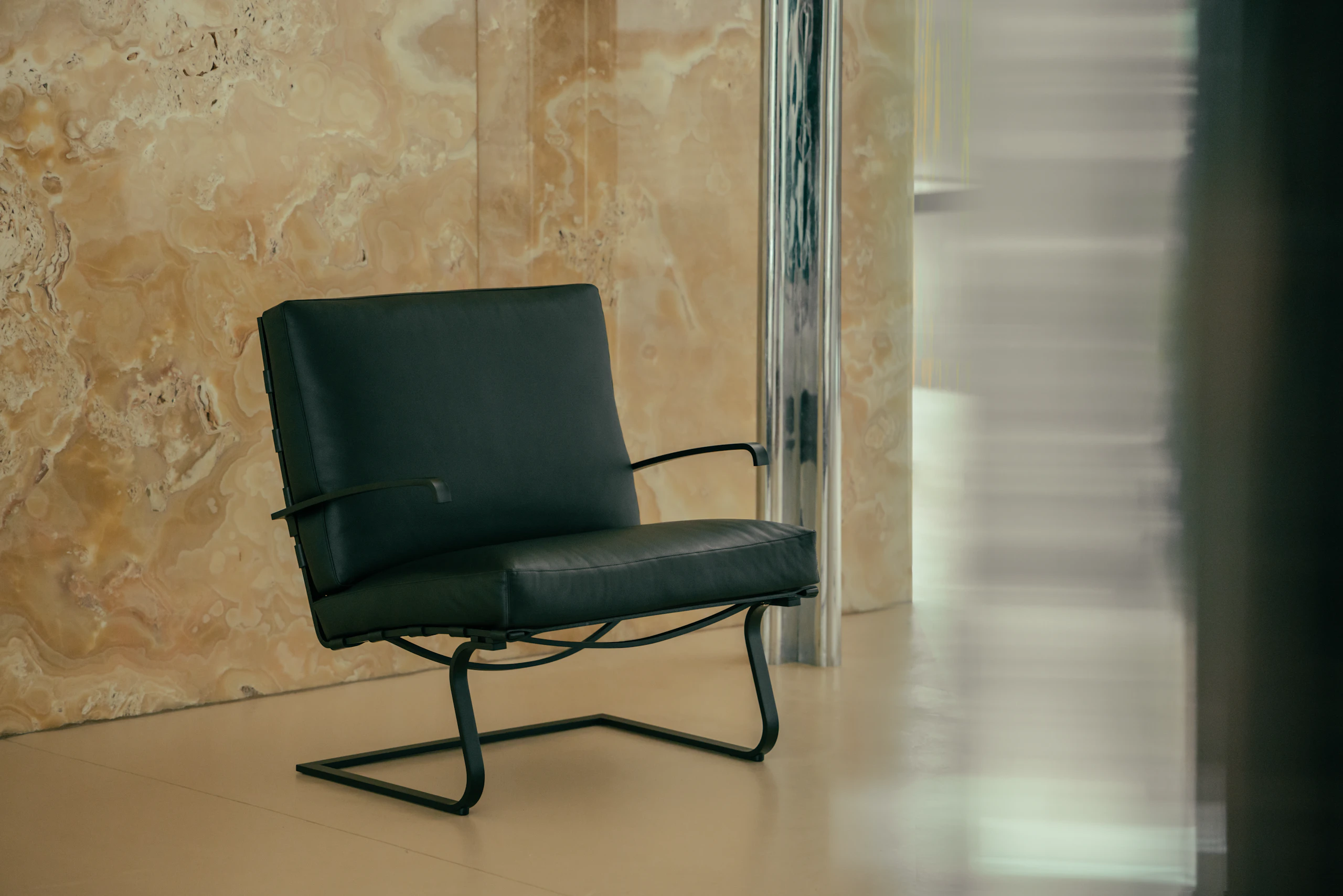 Tugendhat Chair in black leather with a black base and arms at Villa Tugendhat.