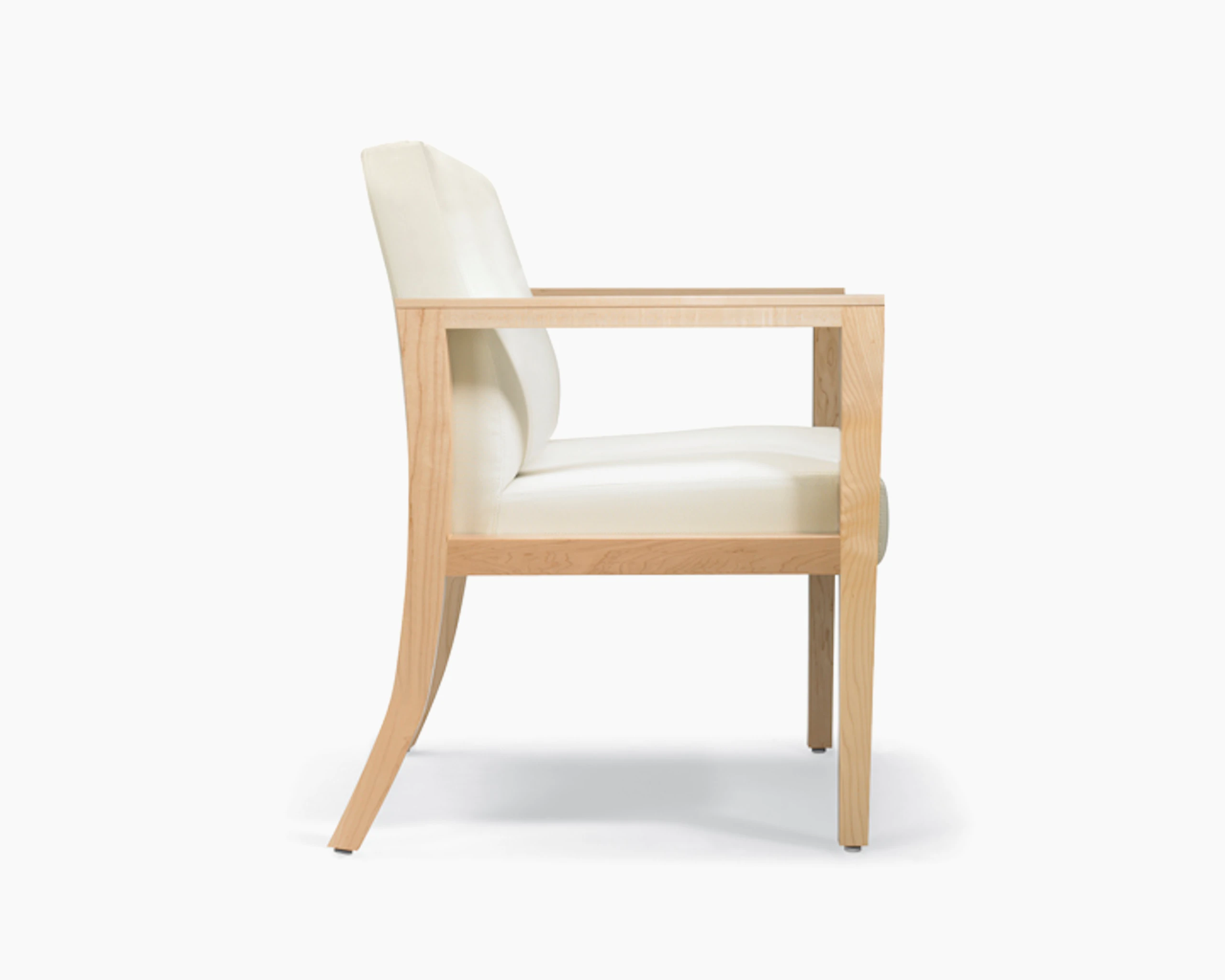 A side view of Brava 863 plus chair in white textile with open maple wood arms.