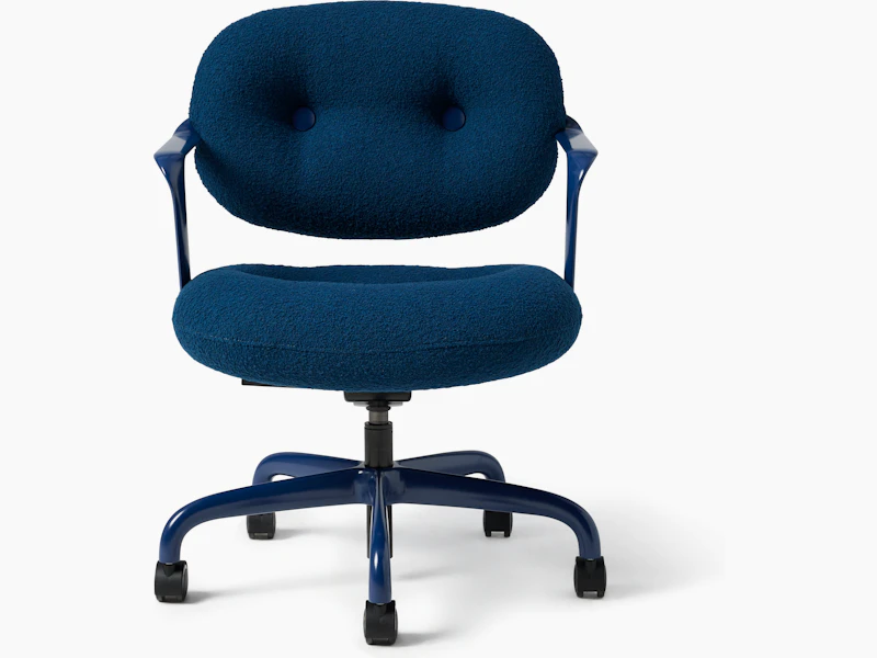 Front view of a Morrison Hannah chair with a blue frame and base with fixed arms and dark blue upholstery.