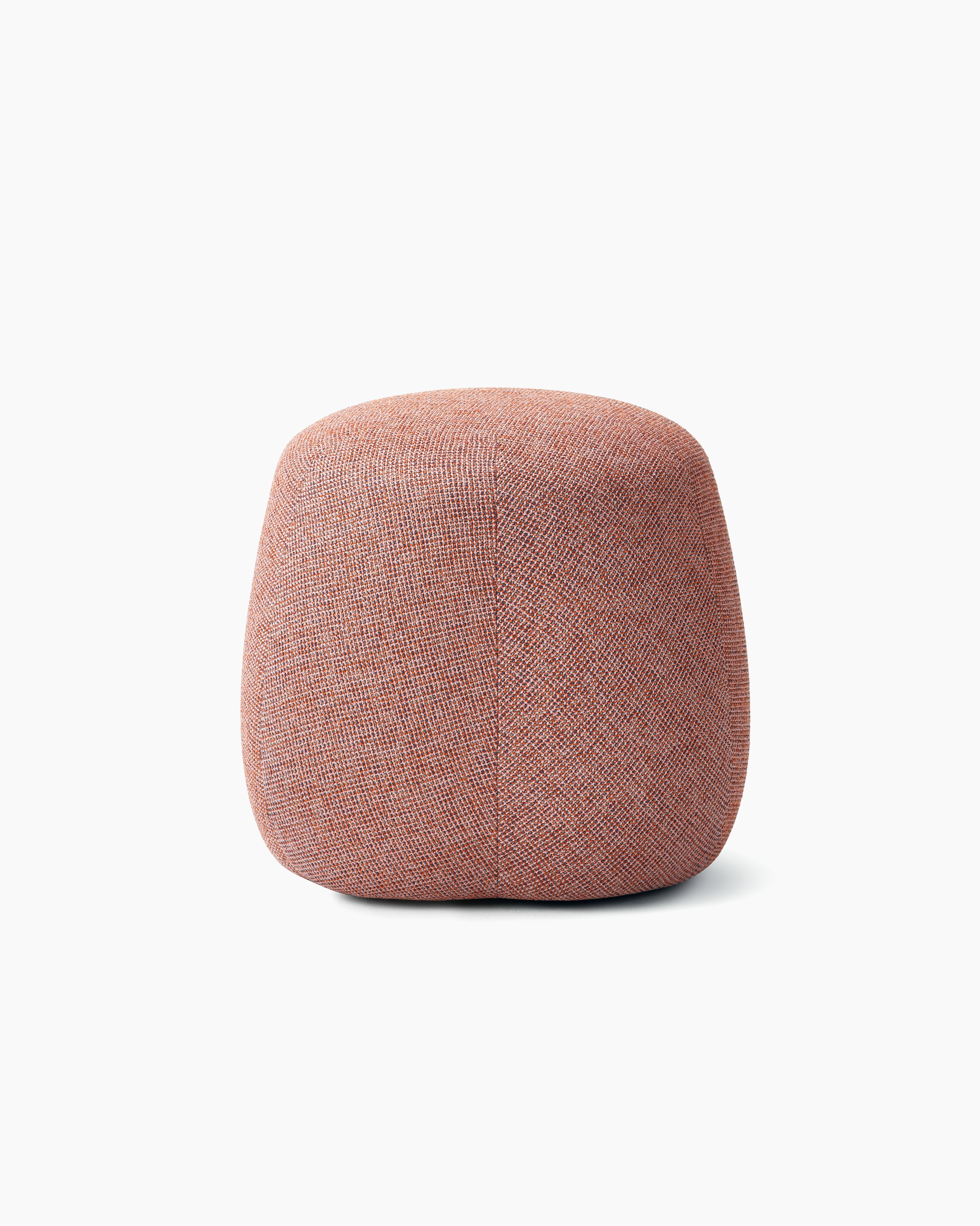 White background shot of a Truffle Pouf, Size B, fully upholstered in pink fabric.