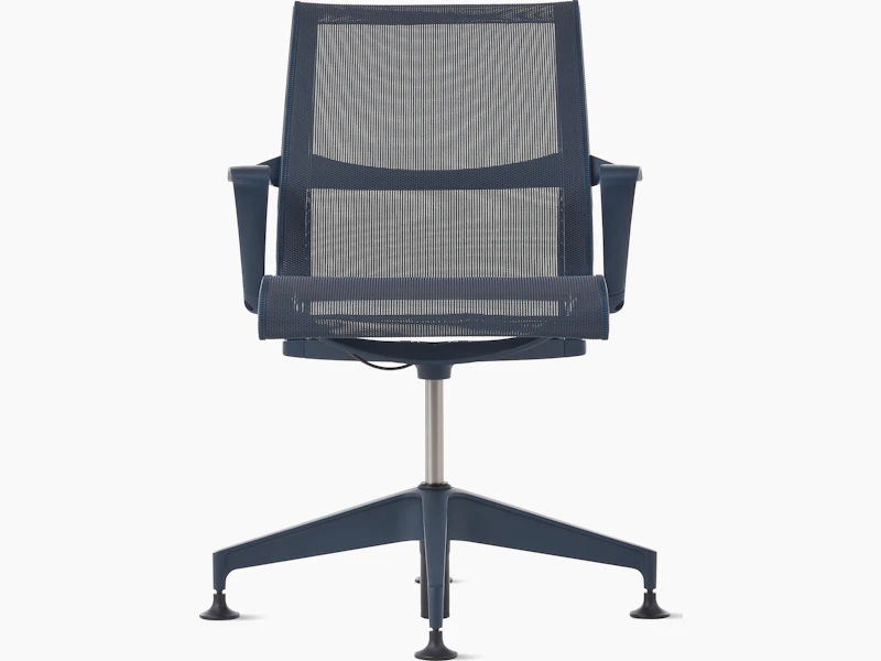 Front view of a Setu side chair with fixed arms in dark blue.