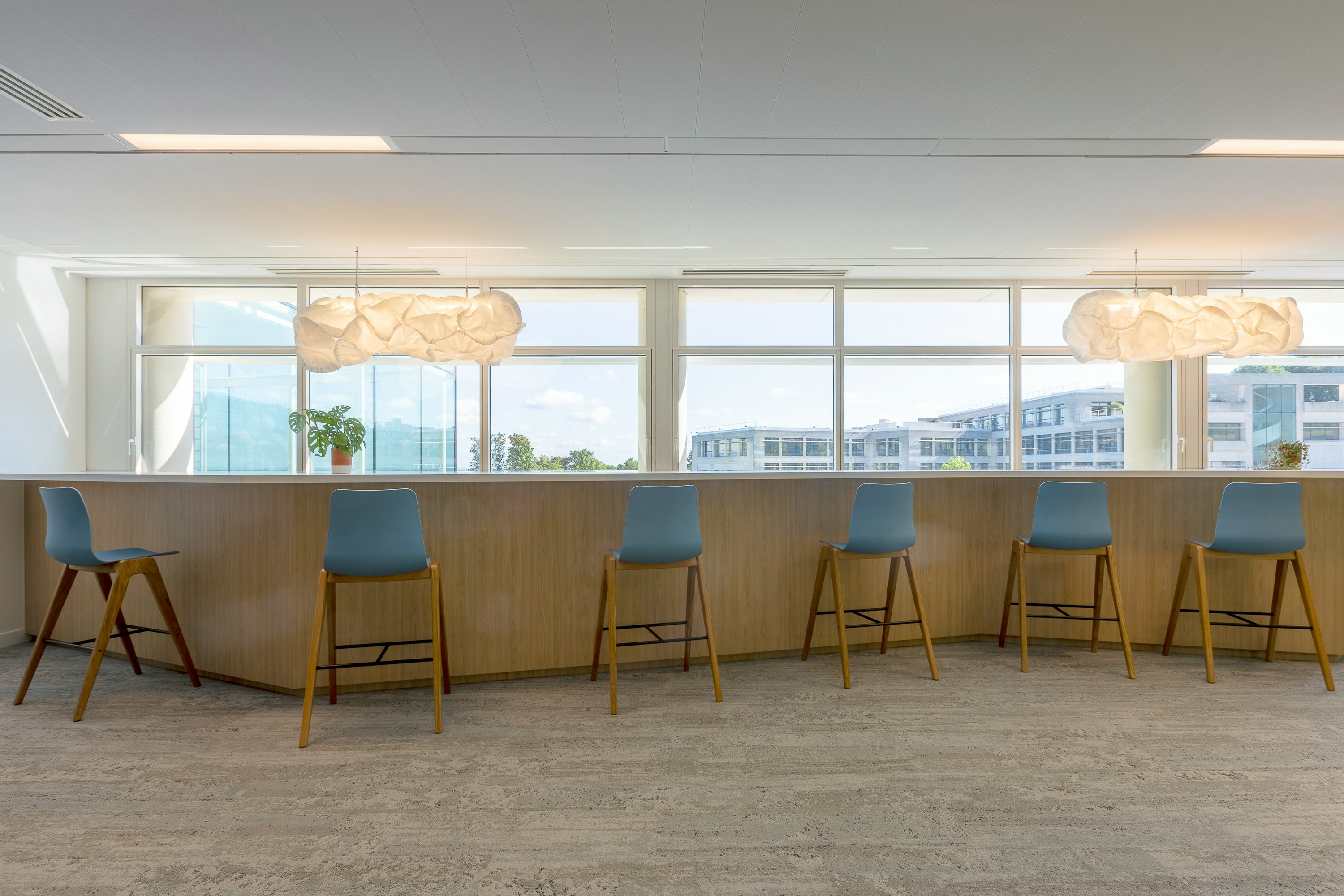 Counter with Polly Stools with wooden legs.