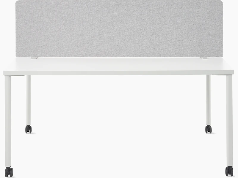 A grey OE1 Movable Screen on a white OE1 Project Table, viewed from the front.