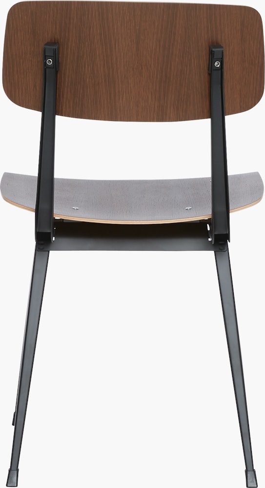 A smoke lacquered oak Result Chair with black base viewed from the back
