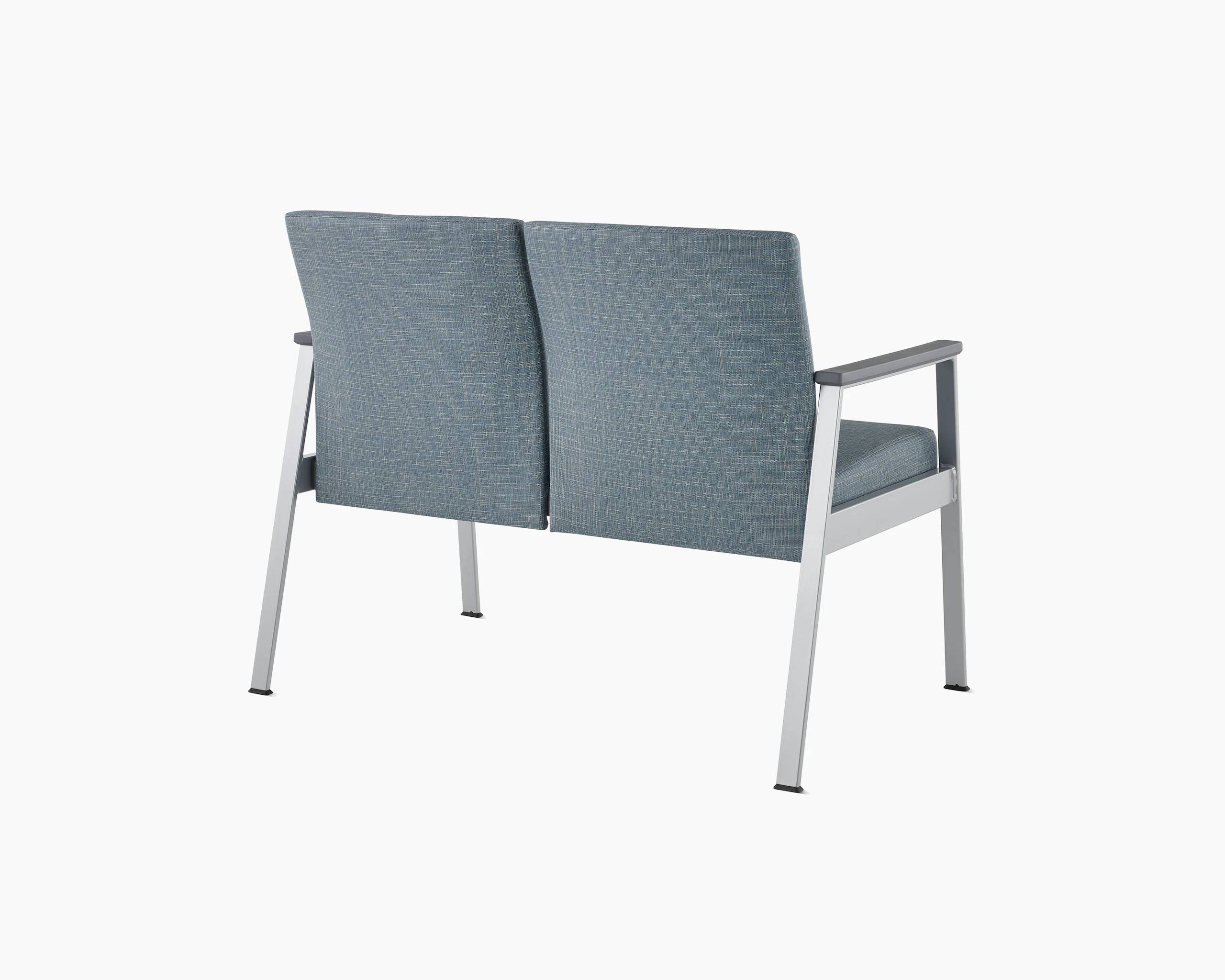 Rear angle view of Easton Multiple Seating with two seats, blue upholstery, metallic silver frame and grey arm caps.