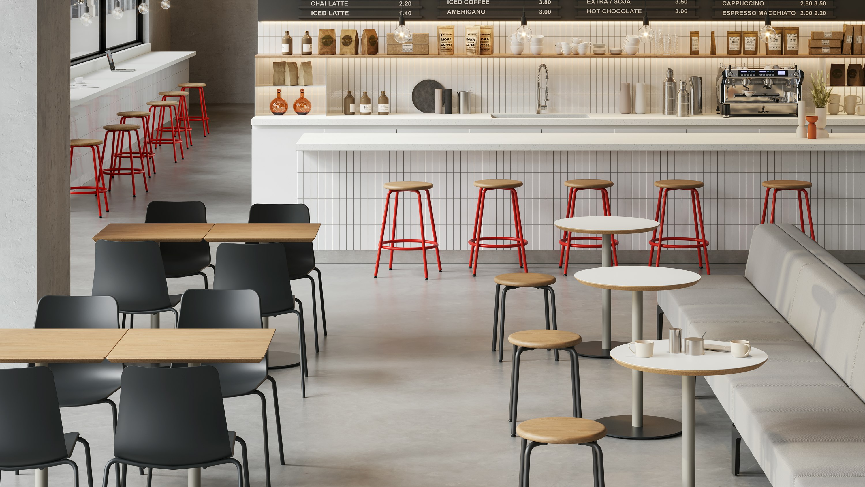 Square and round Tier café tables in the foreground with Penny counter height stools arranged in front of a bar.