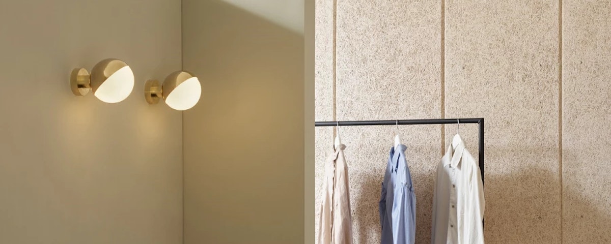 Two VL Studio Wall Lamps in a walk-in closet setting