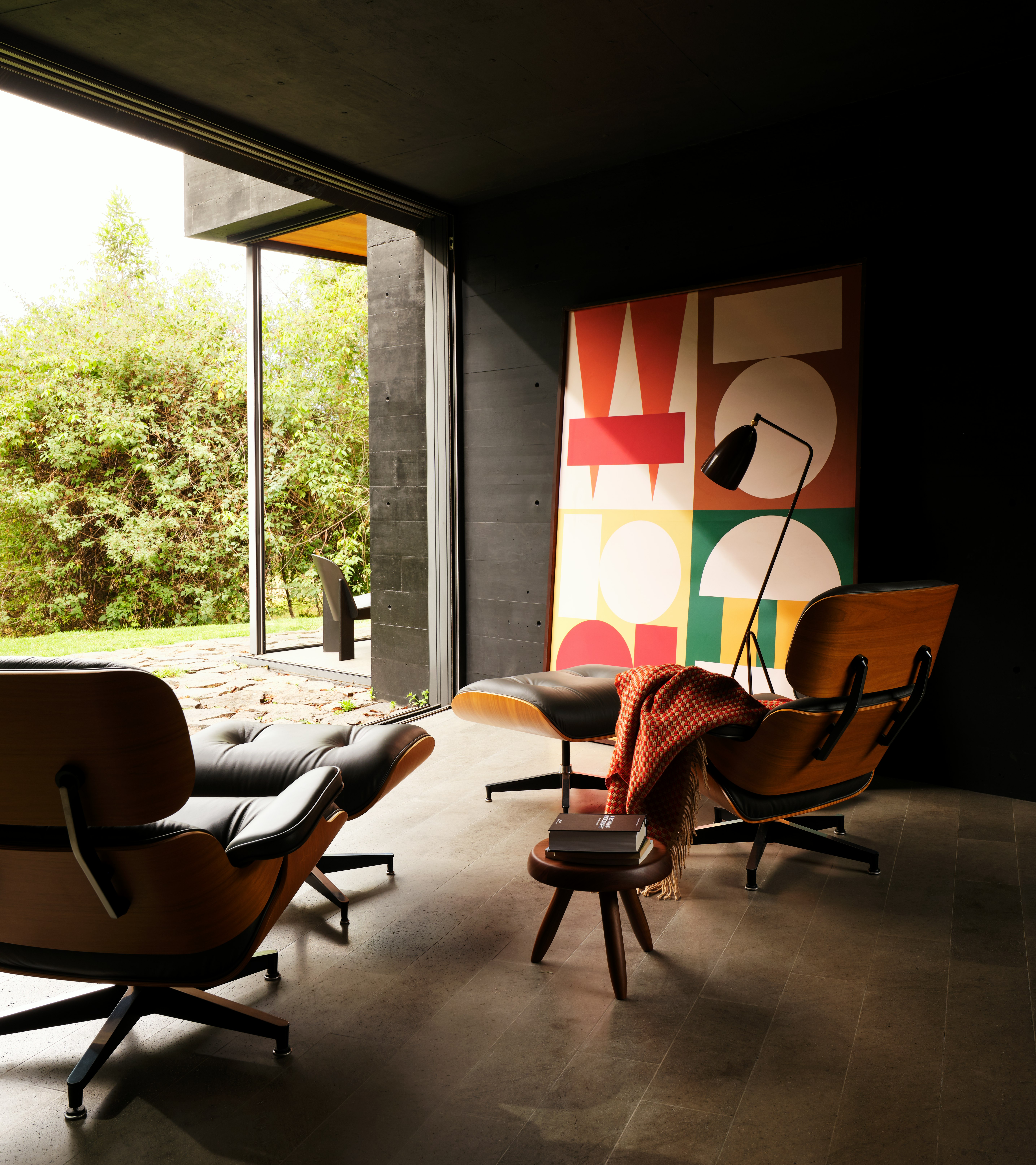 Eames Lounge and Ottomans in Black and Walnut