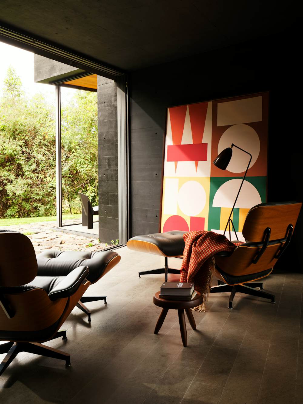 Eames Lounge and Ottomans in Black and Walnut