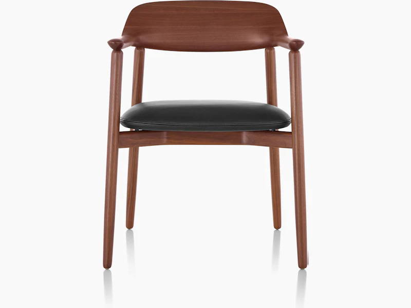A Crosshatch Side Chair with a black leather seat pad and a wood frame in a medium finish, viewed from the front.