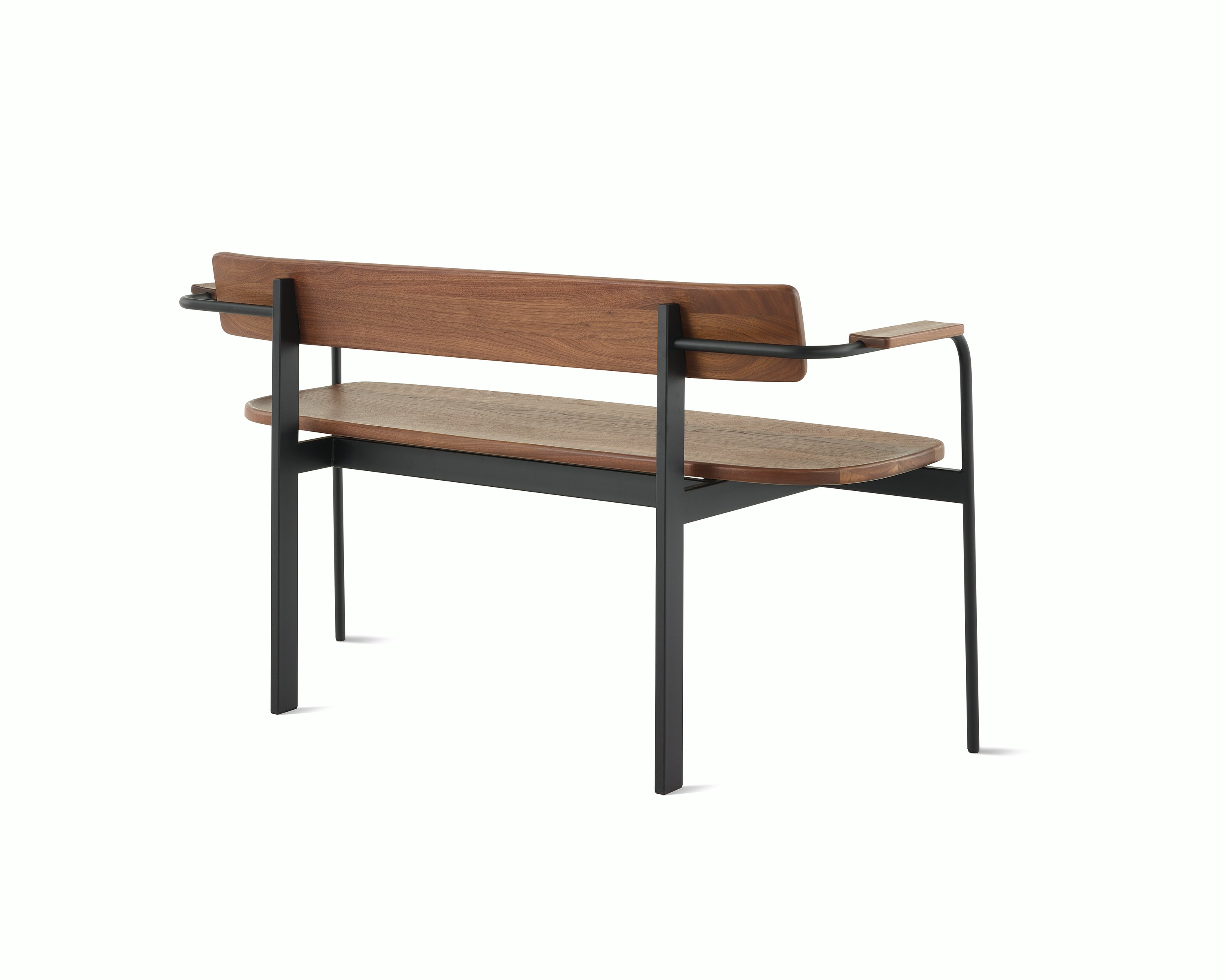 A Betwixt Bench with walnut seat, backrest, and arms with a black frame.