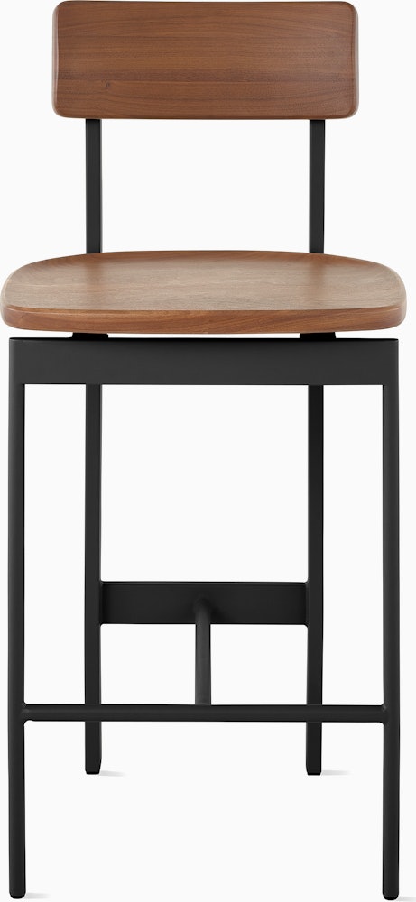 An walnut counter height Betwixt Stool with a black frame.