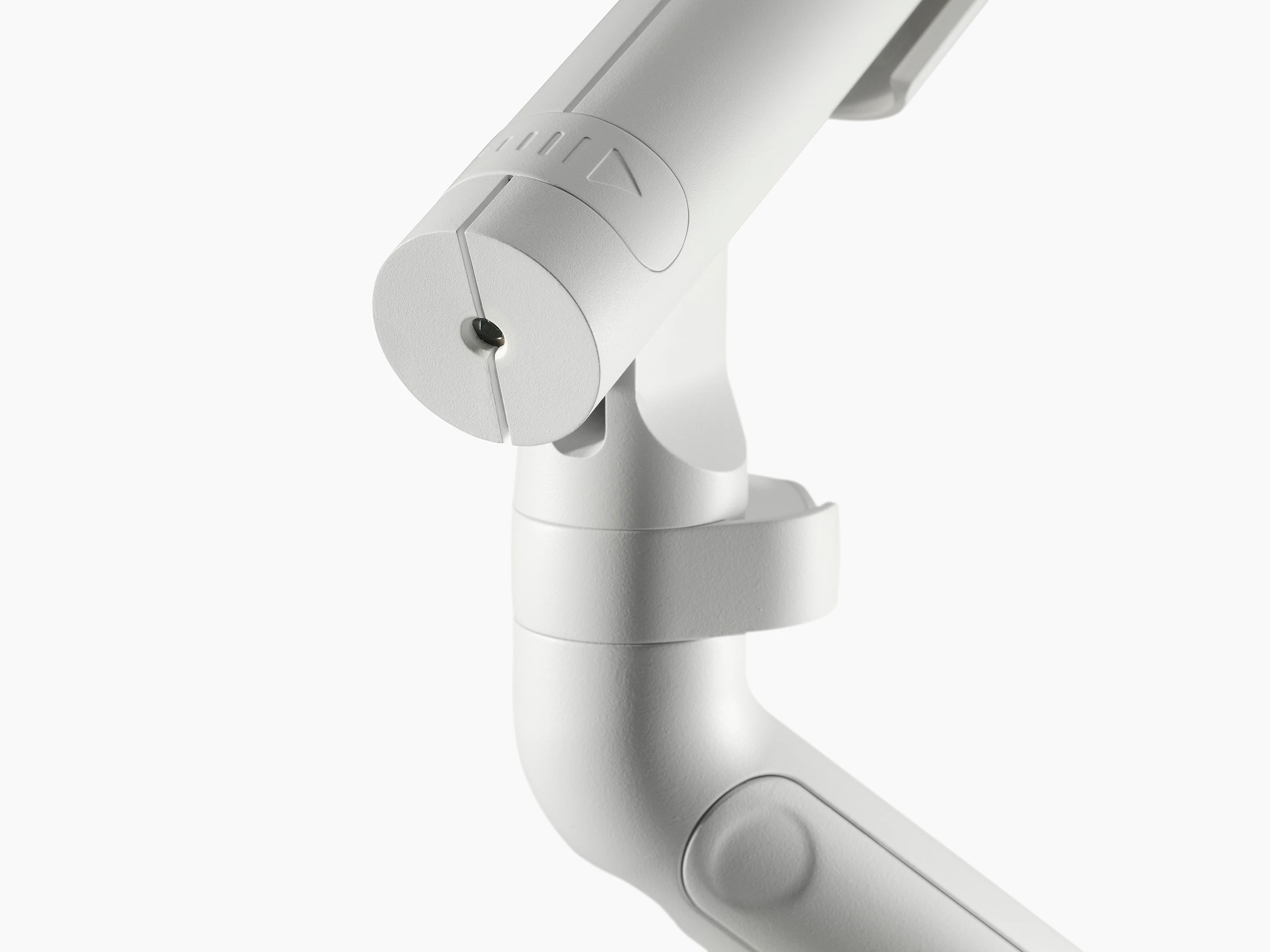 A close up of a Flo monitor arm weight adjuster in white.