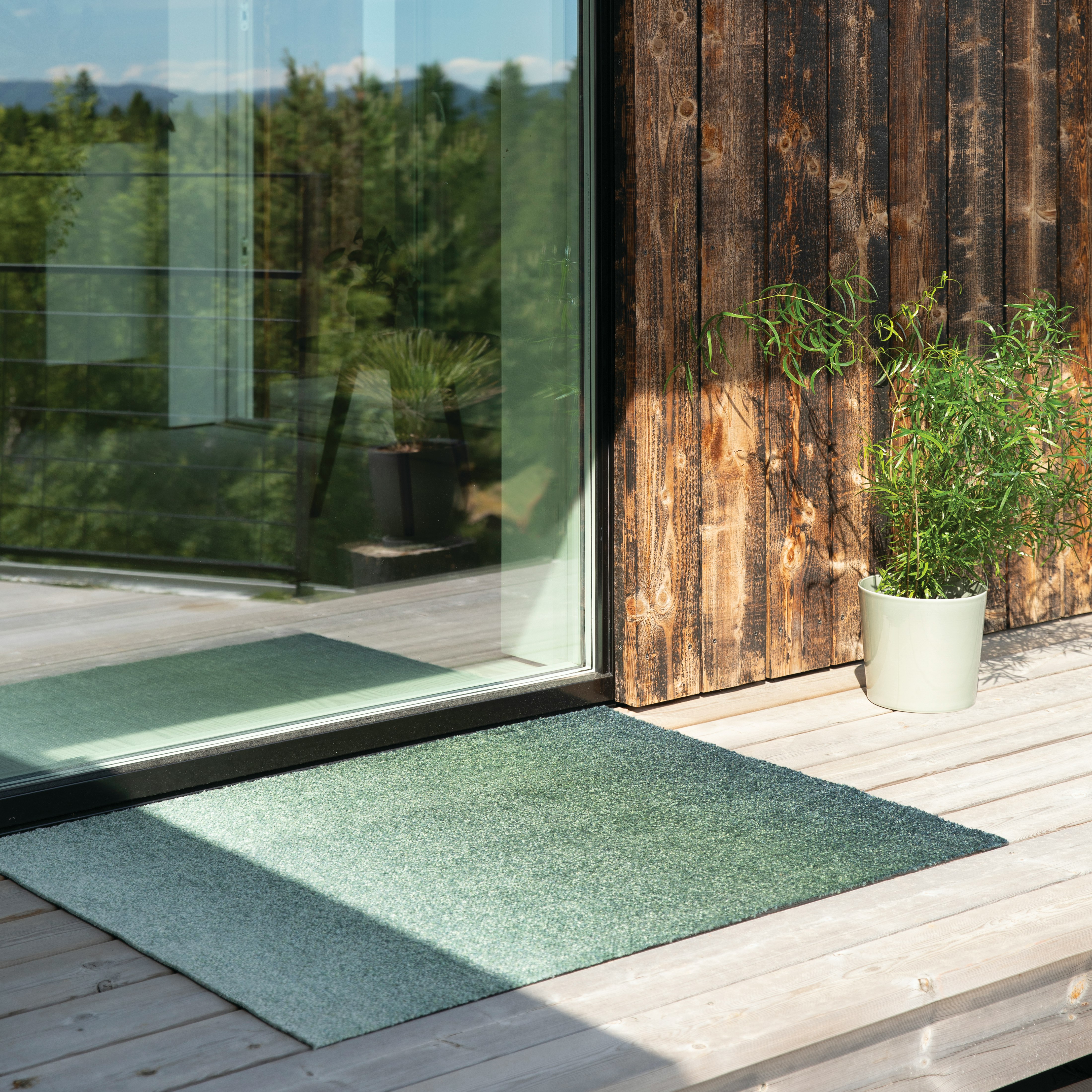 Dis Mat on a deck at an door entryway