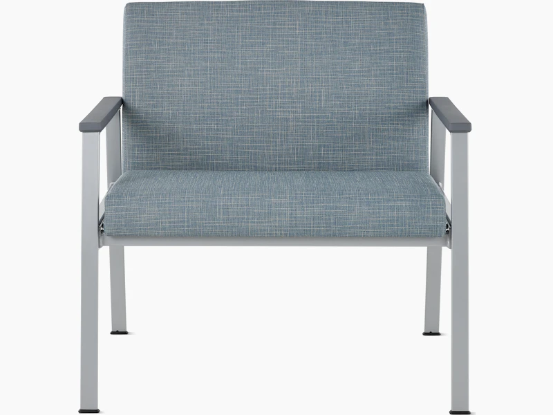 Front view of an Easton Plus Chair with blue upholstery, metallic four leg base and slate grey arm caps.