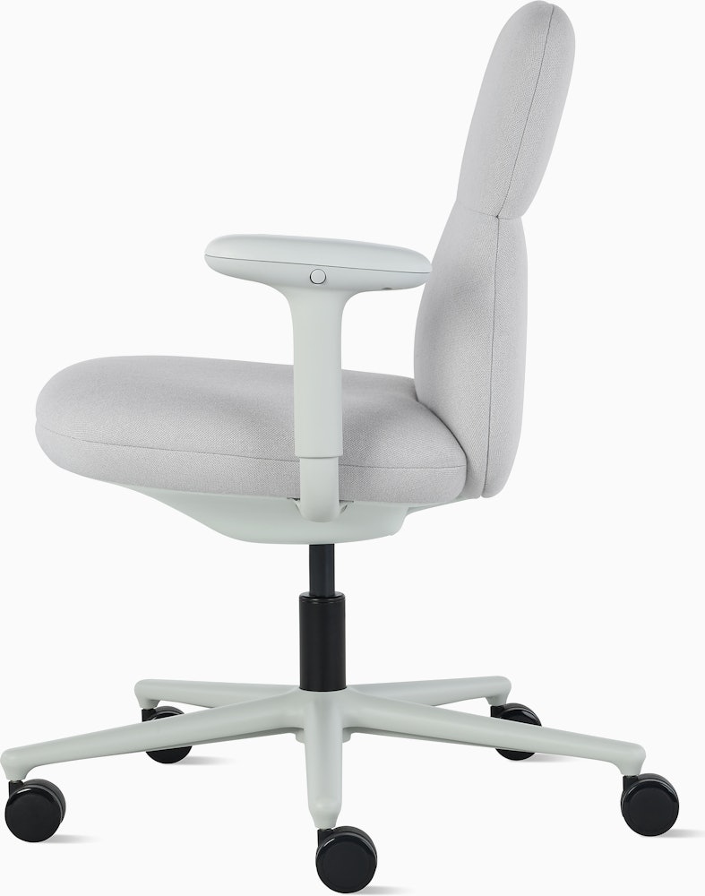 Side view of a mid-back Asari chair by Herman Miller in light grey with height adjustable arms.
