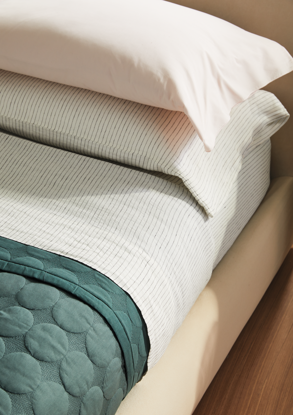 DWR bedding, Linen Stripe and HAY Mega Dot Bedspread in a bedroom setting