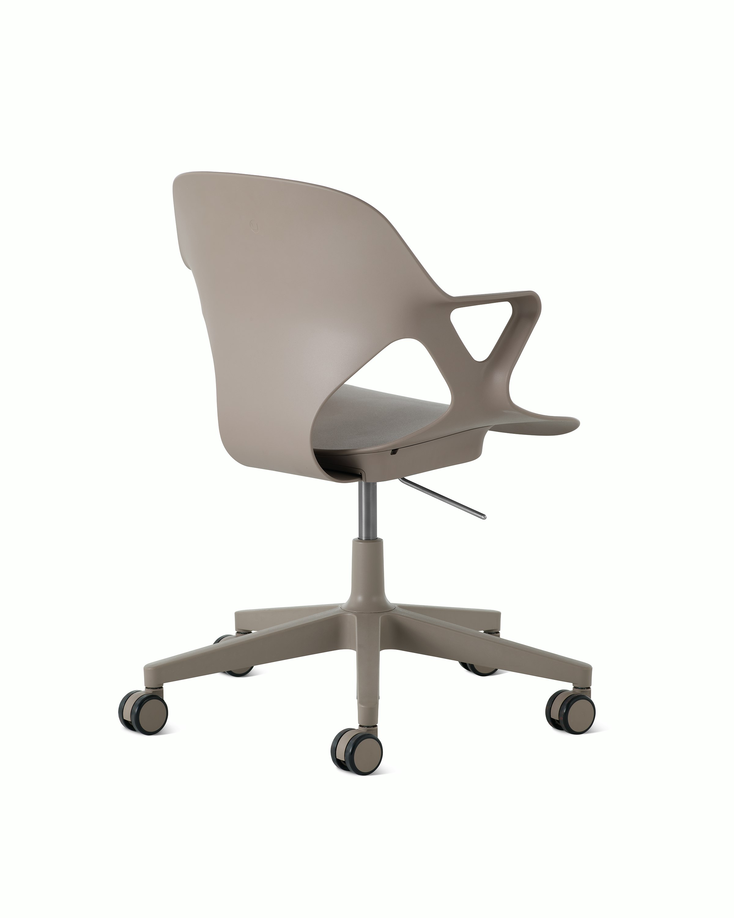 Rear angle view of a Zeph chair with fixed arms in light brown.