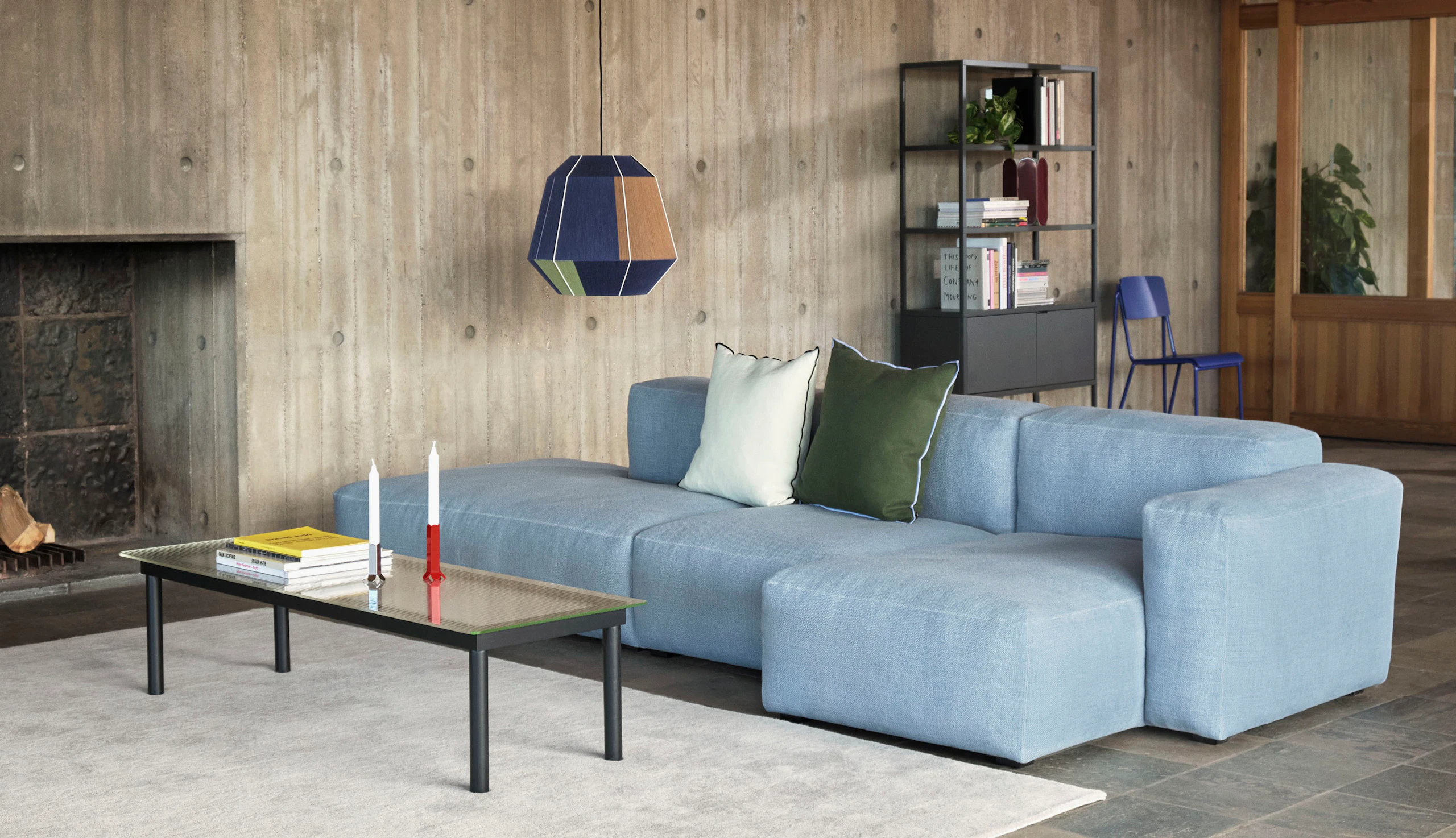 A Kofi Coffee Table positioned next to a Mags Soft Sectional Sofa.