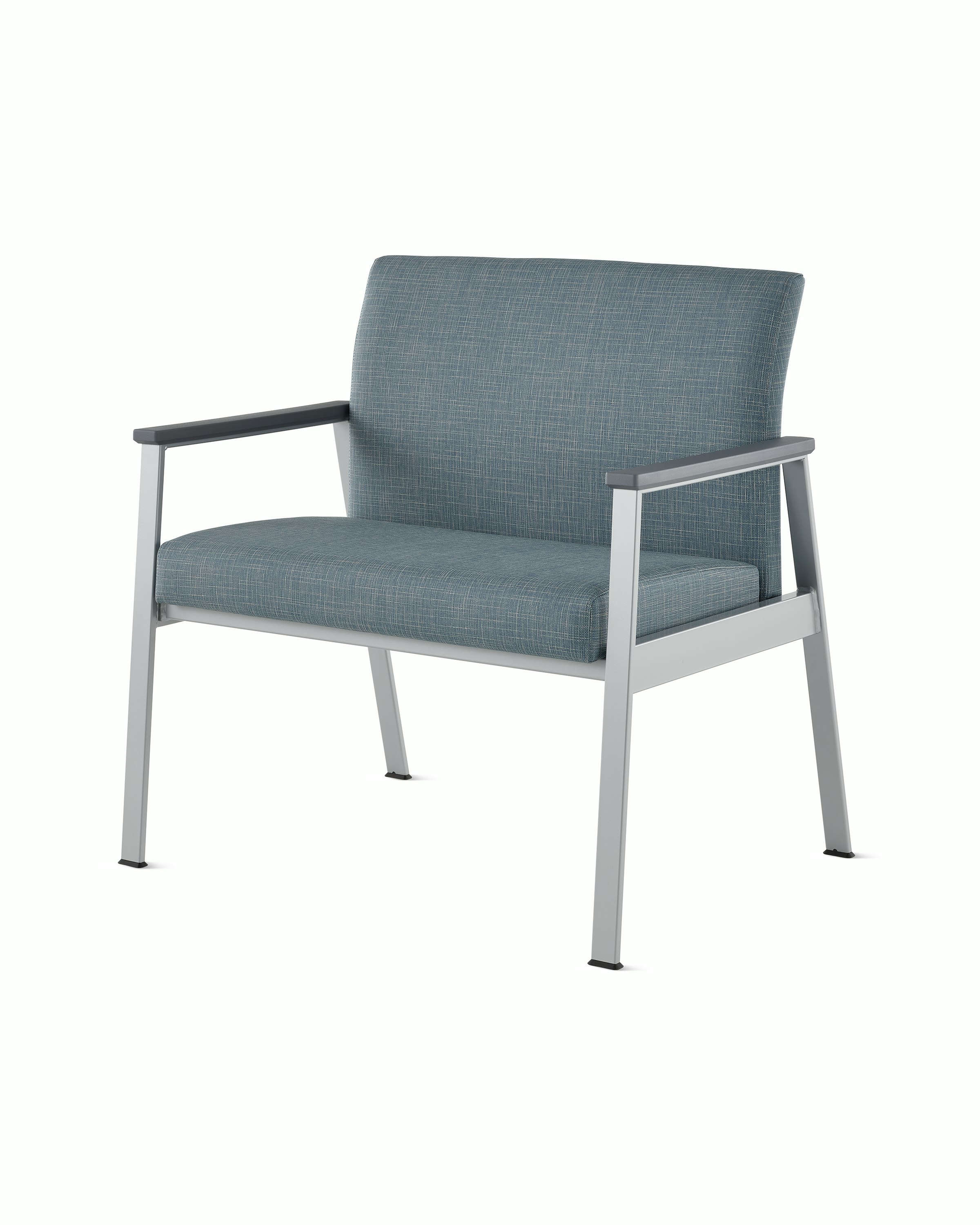 Front angle view of an Easton Plus Chair with blue upholstery, metallic four leg base and slate grey arm caps.