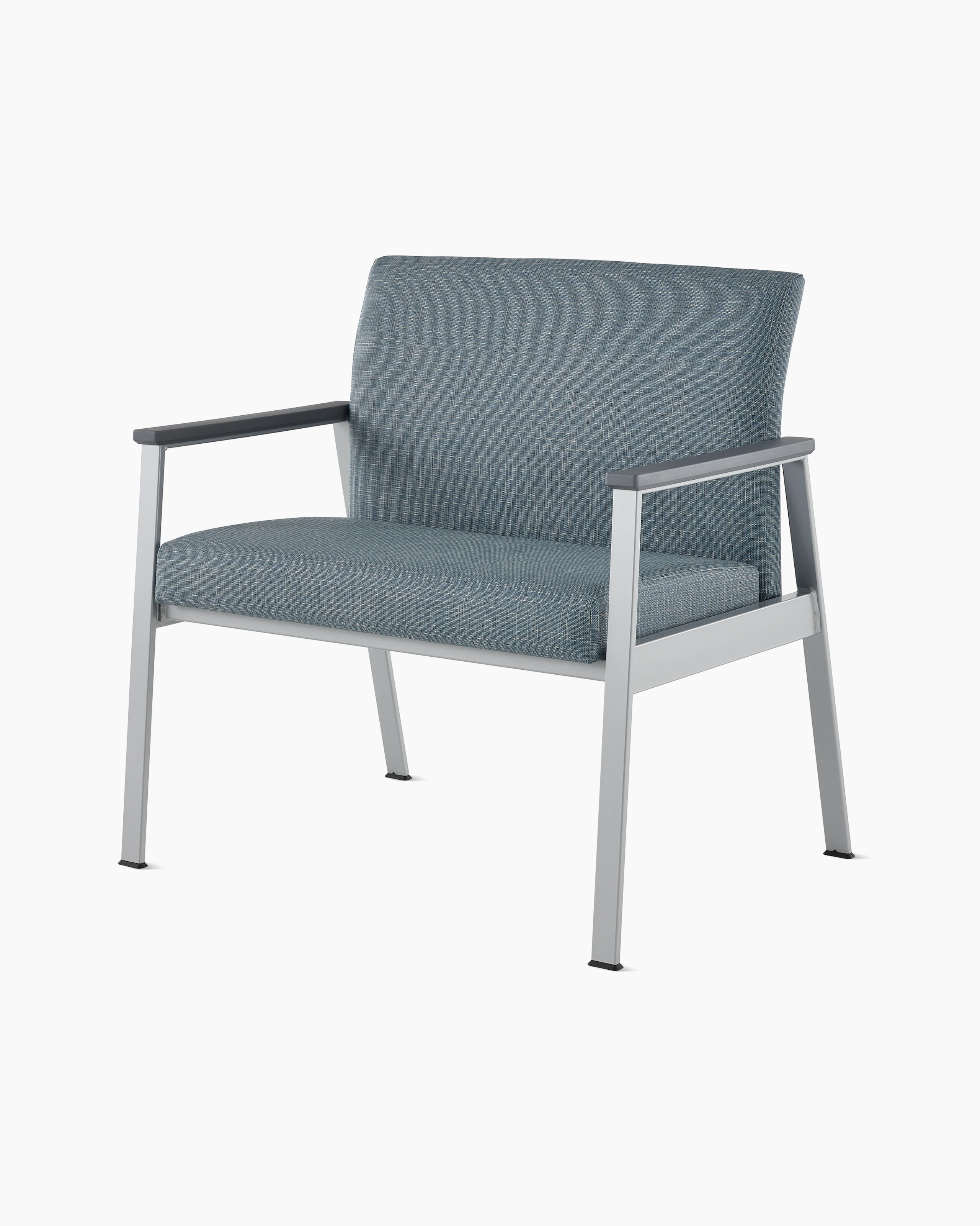 Front angle view of an Easton Plus Chair with blue upholstery, metallic four leg base and slate grey arm caps.