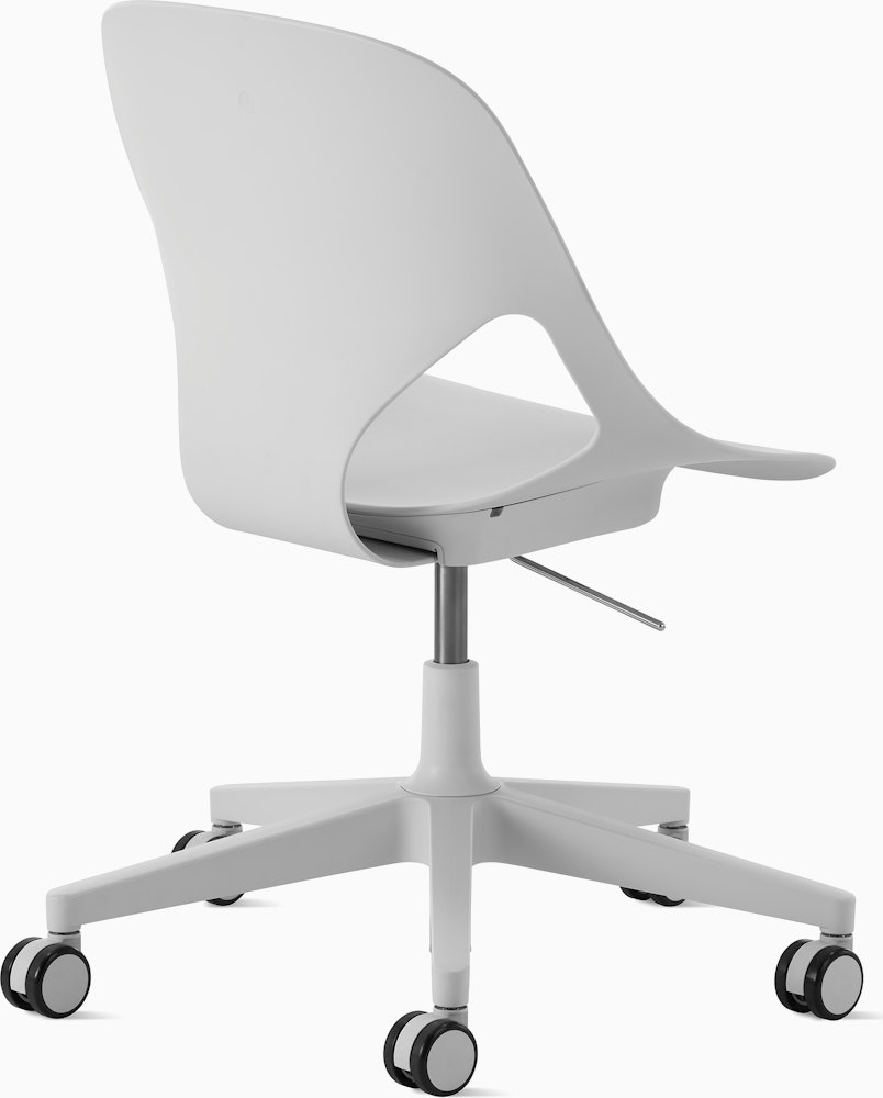 Rear angle view of a light grey armless Zeph chair.