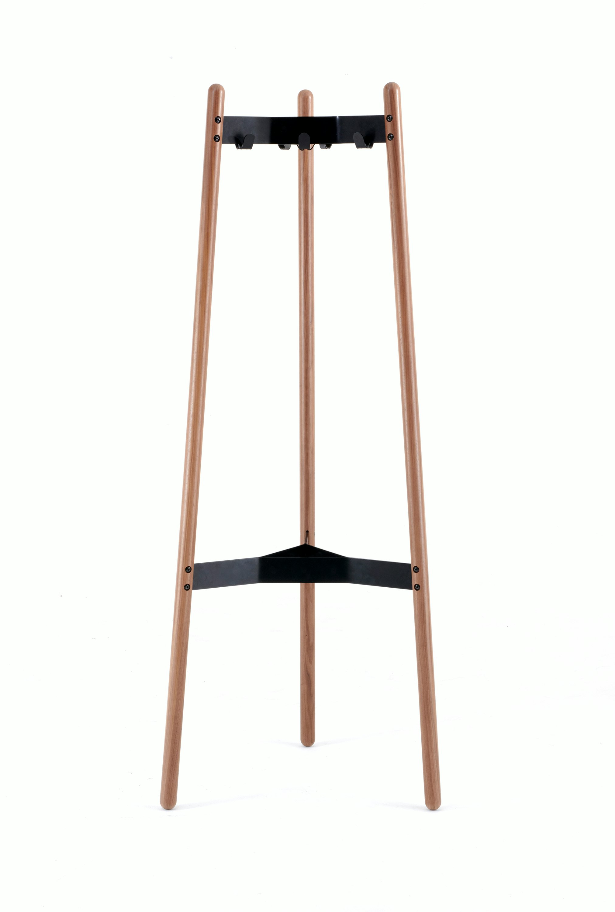 A front view of a Hudson Coat Stand with walnut dowel legs and black metal supports.