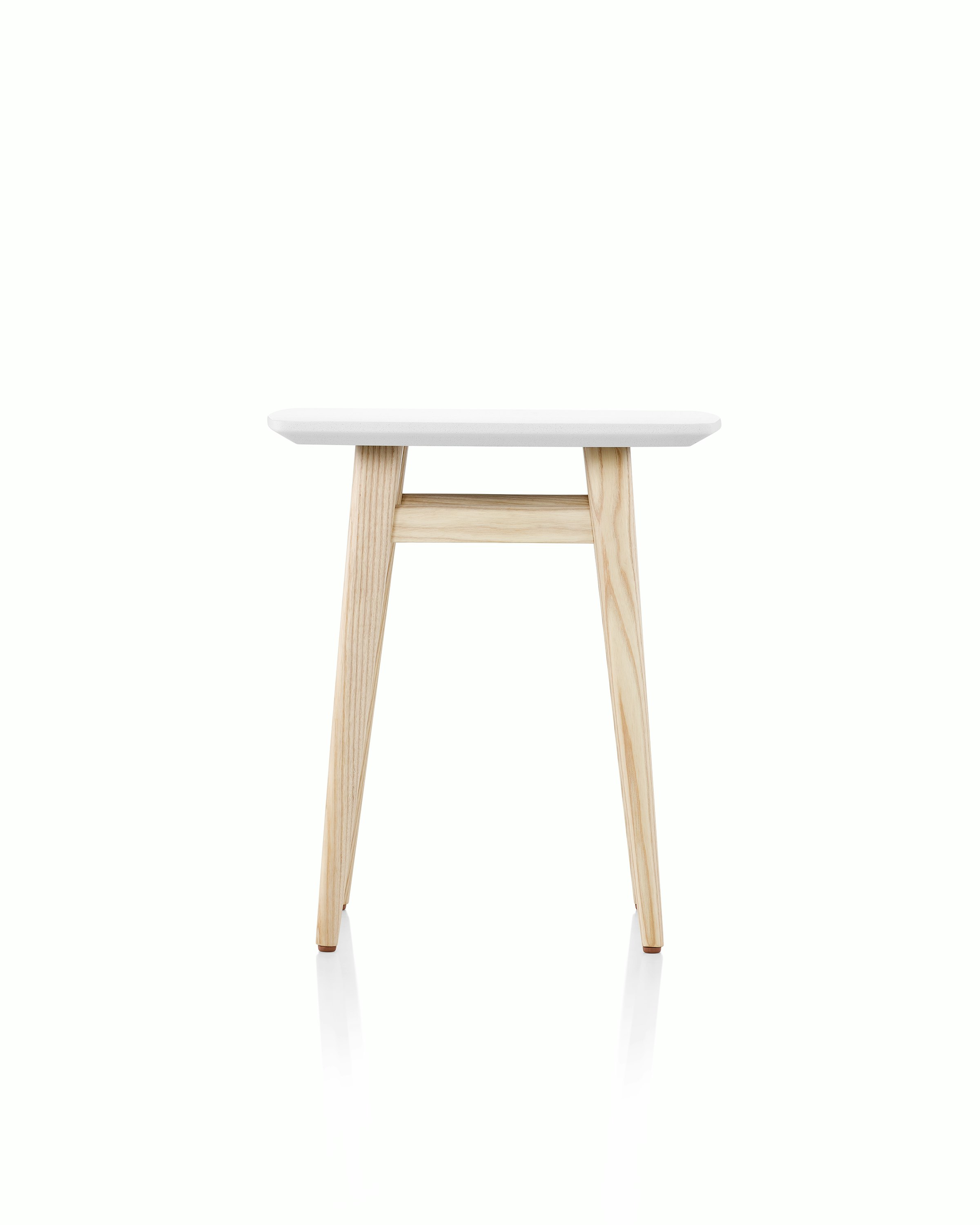 Palisade Occasional Table with wood legs and solid surface top on white sweep.