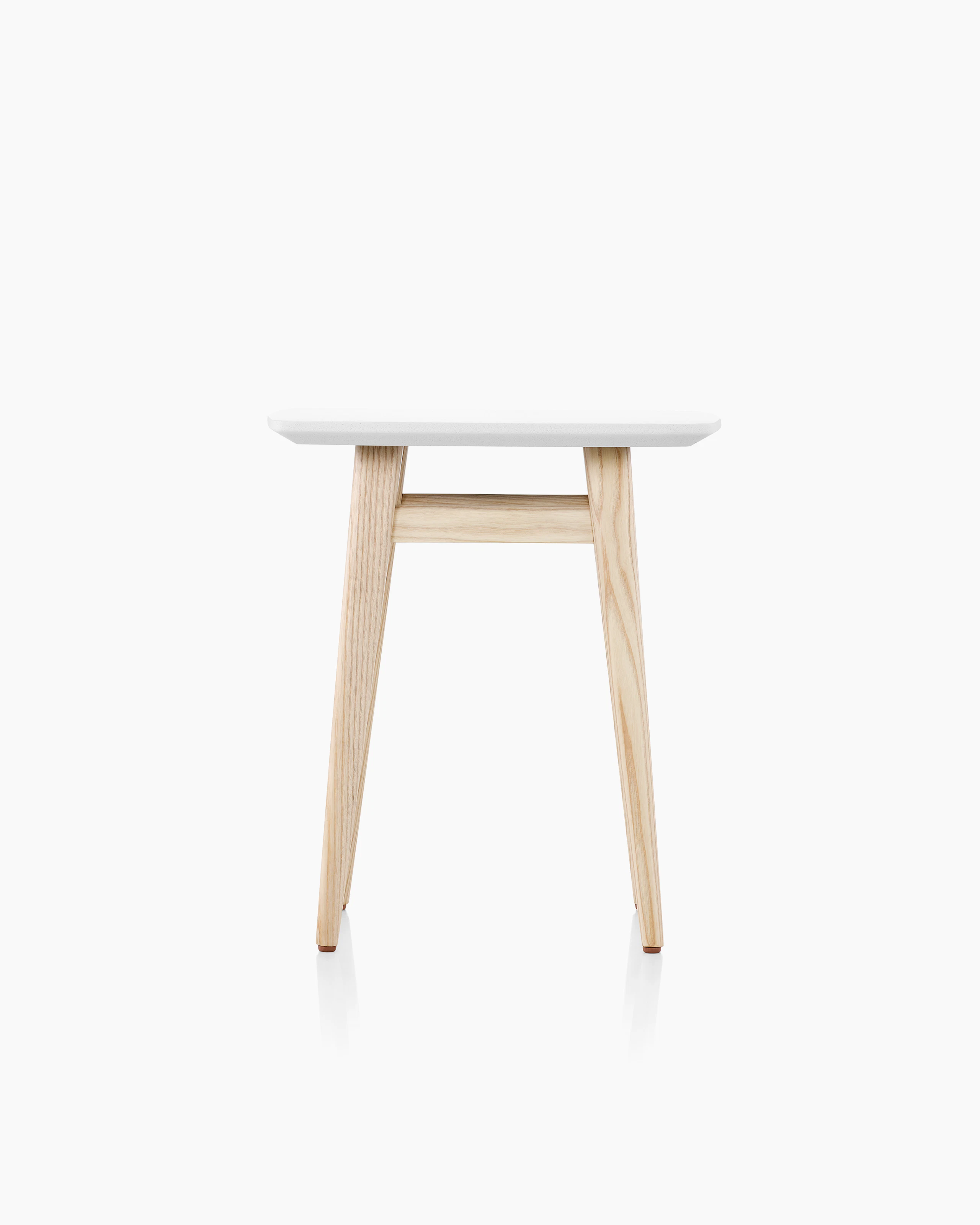 Palisade Occasional Table with wood legs and solid surface top on white sweep.