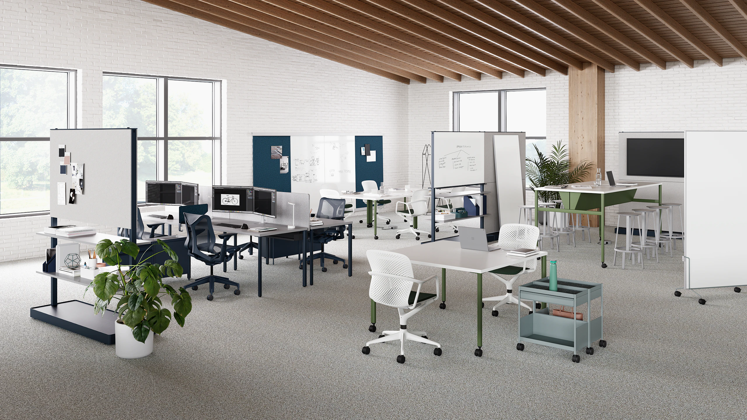 OE1 Workspace Collection products in a open floor setting, including tables, movable walls, display monitor and wall rail and boards.
