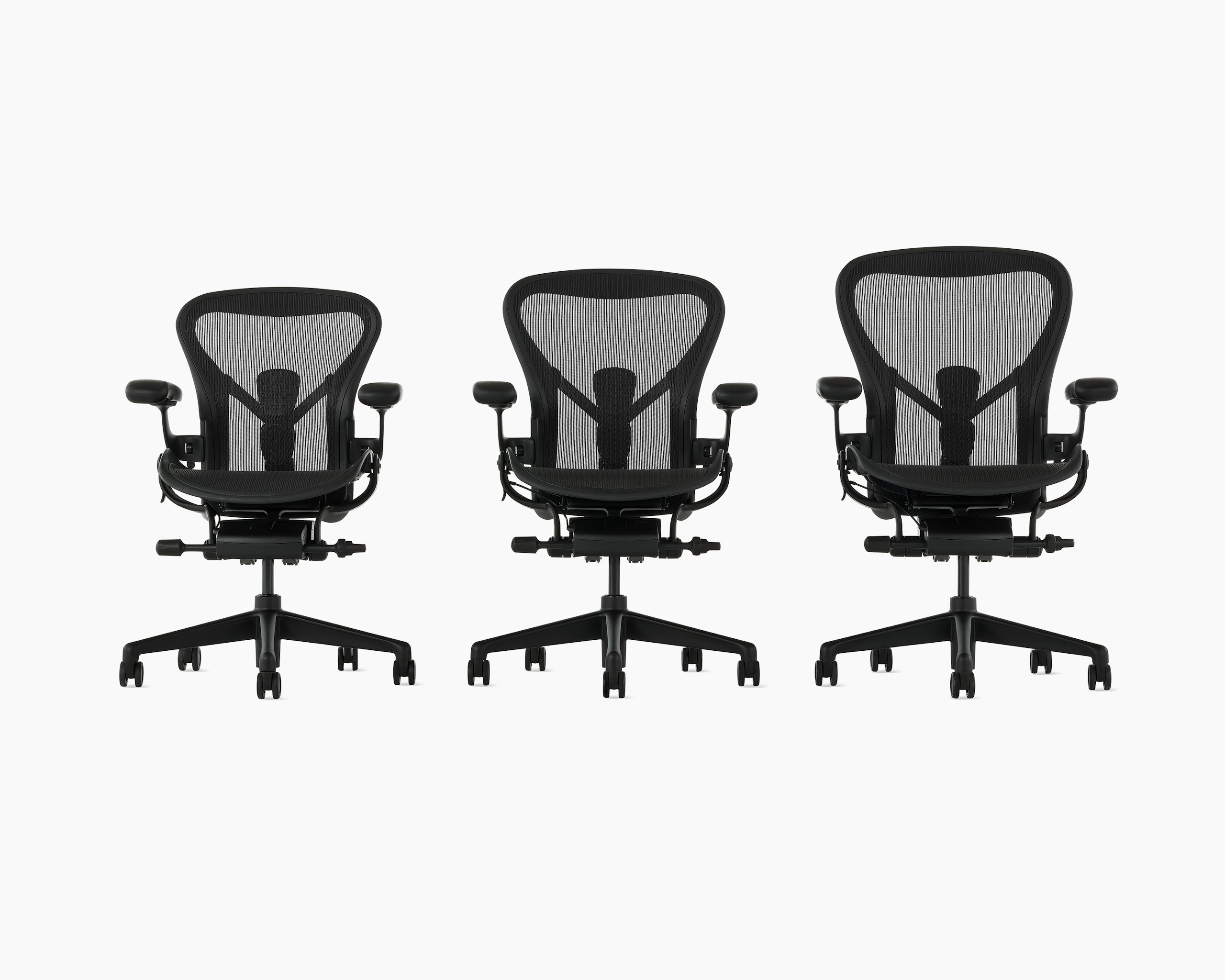 Three matte black Aeron Chairs, size A, B, and C on a white background with a 5-star base and ergonomic back support, viewed from the front.