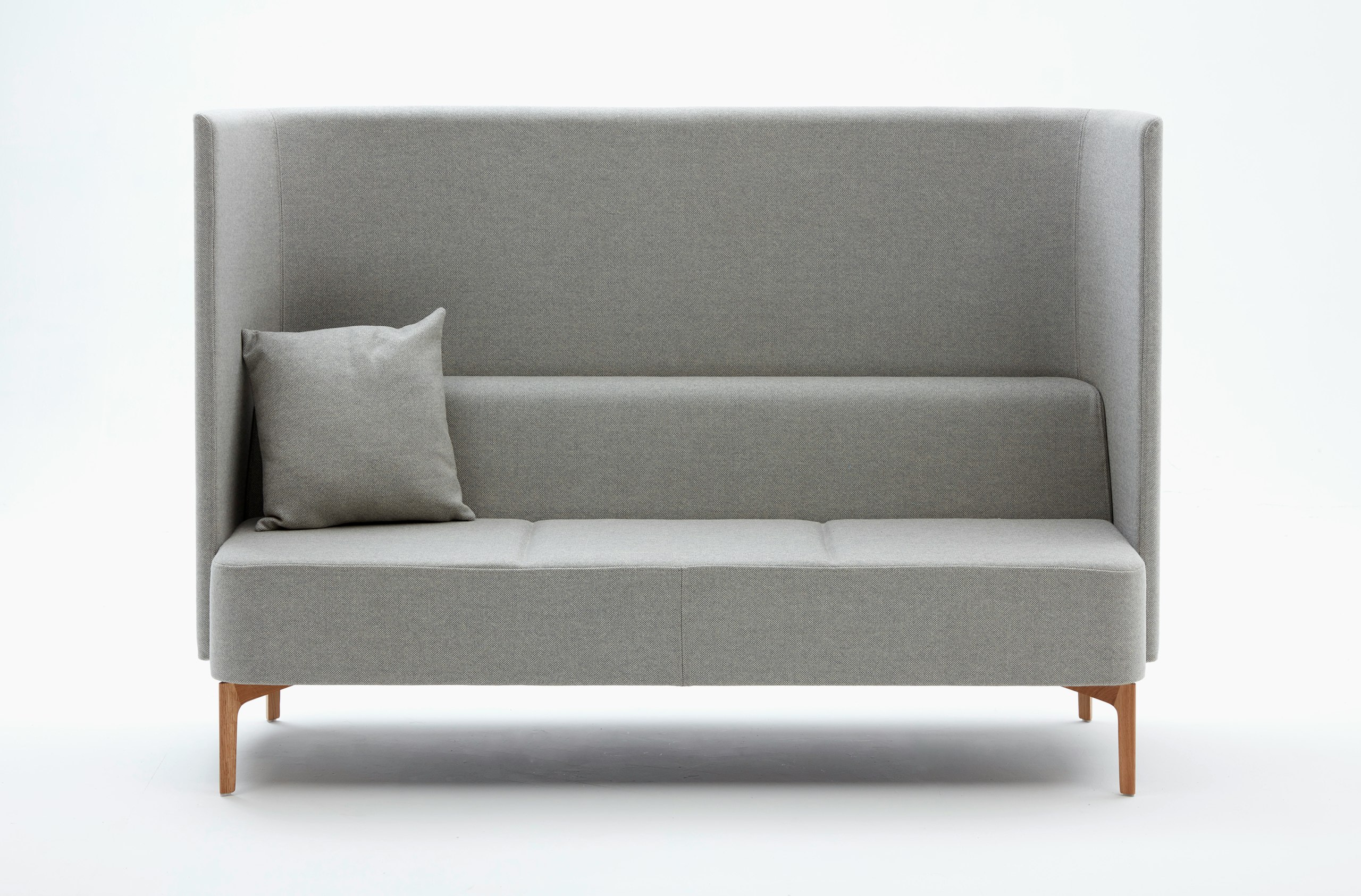 Front view of 3 seat highback Pullman Sofa upholstered in pale grey fabric with cushion and oak legs.