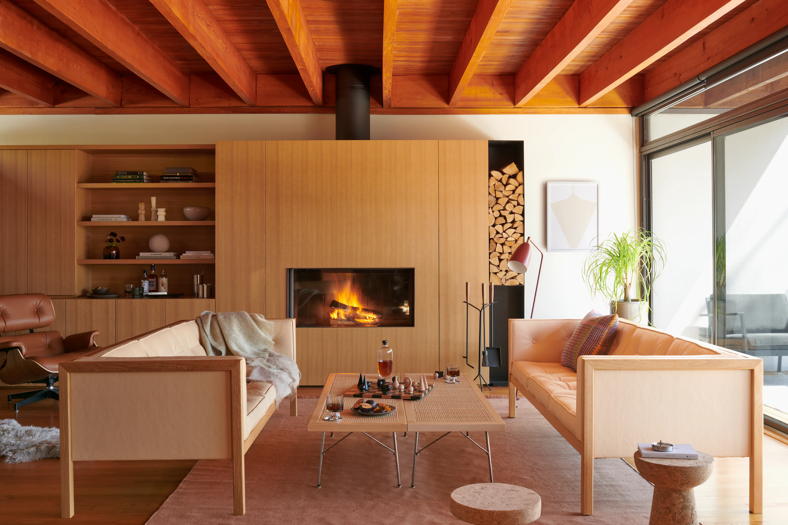 Nelson Cube Sofa - 80 in, Nelson Cane Bench, Nelson Fireplace Tools, Grasshopper Floor Lamp, Man Ray Chess Set, Pallo Flatweave Linen Rug, Vitra Cork Stools, Small White Ray I by Aschely Vaughan Cone, Eames Lounge and Ottoman