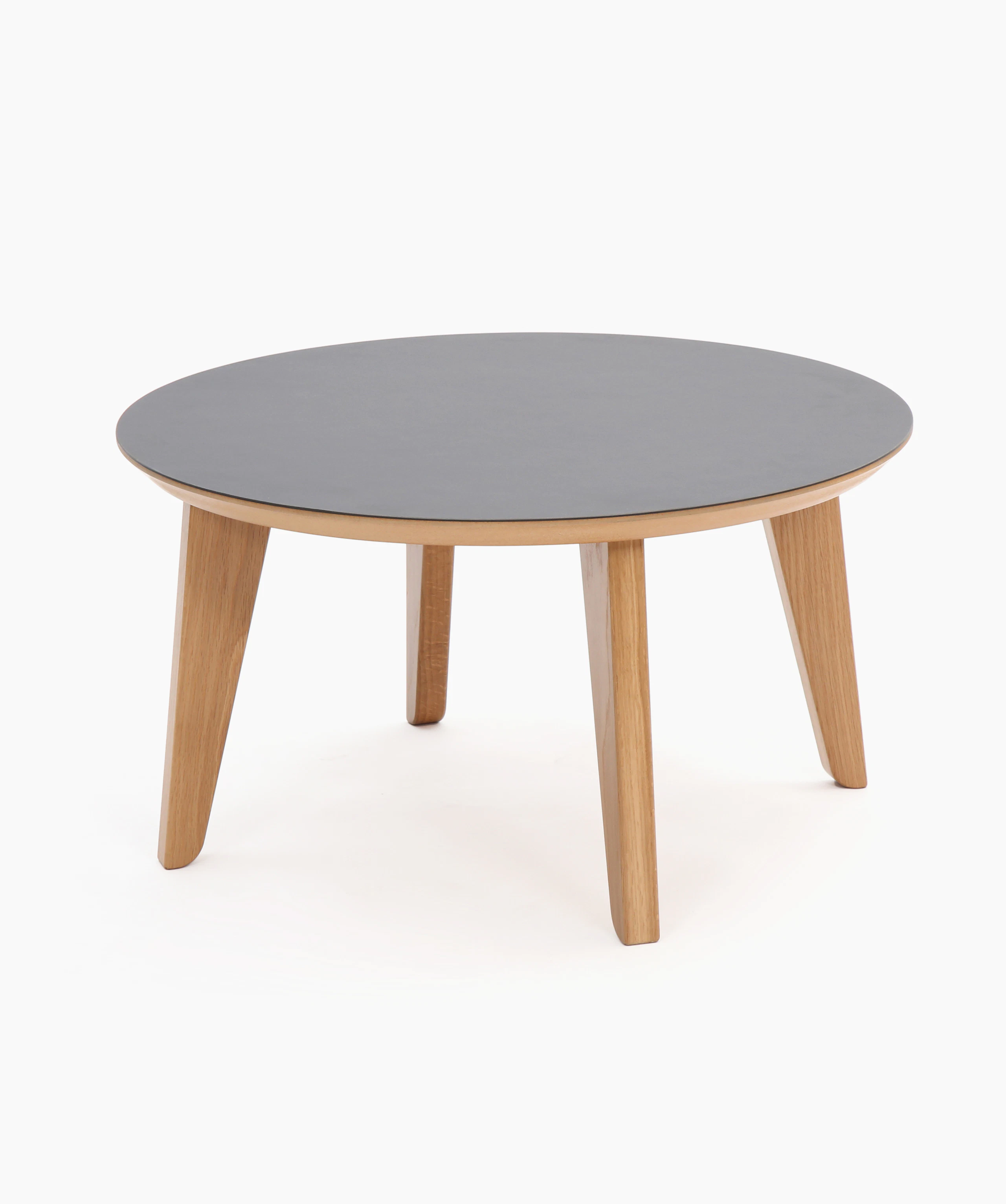 A round black Dalby Coffee Table, viewed at an angle.