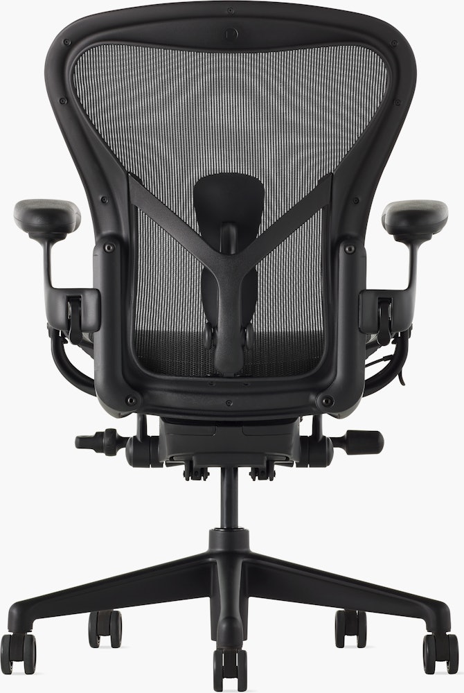 Black matte Aeron Chair on a white background with a 5-star base and ergonomic back support, view of the chair back.