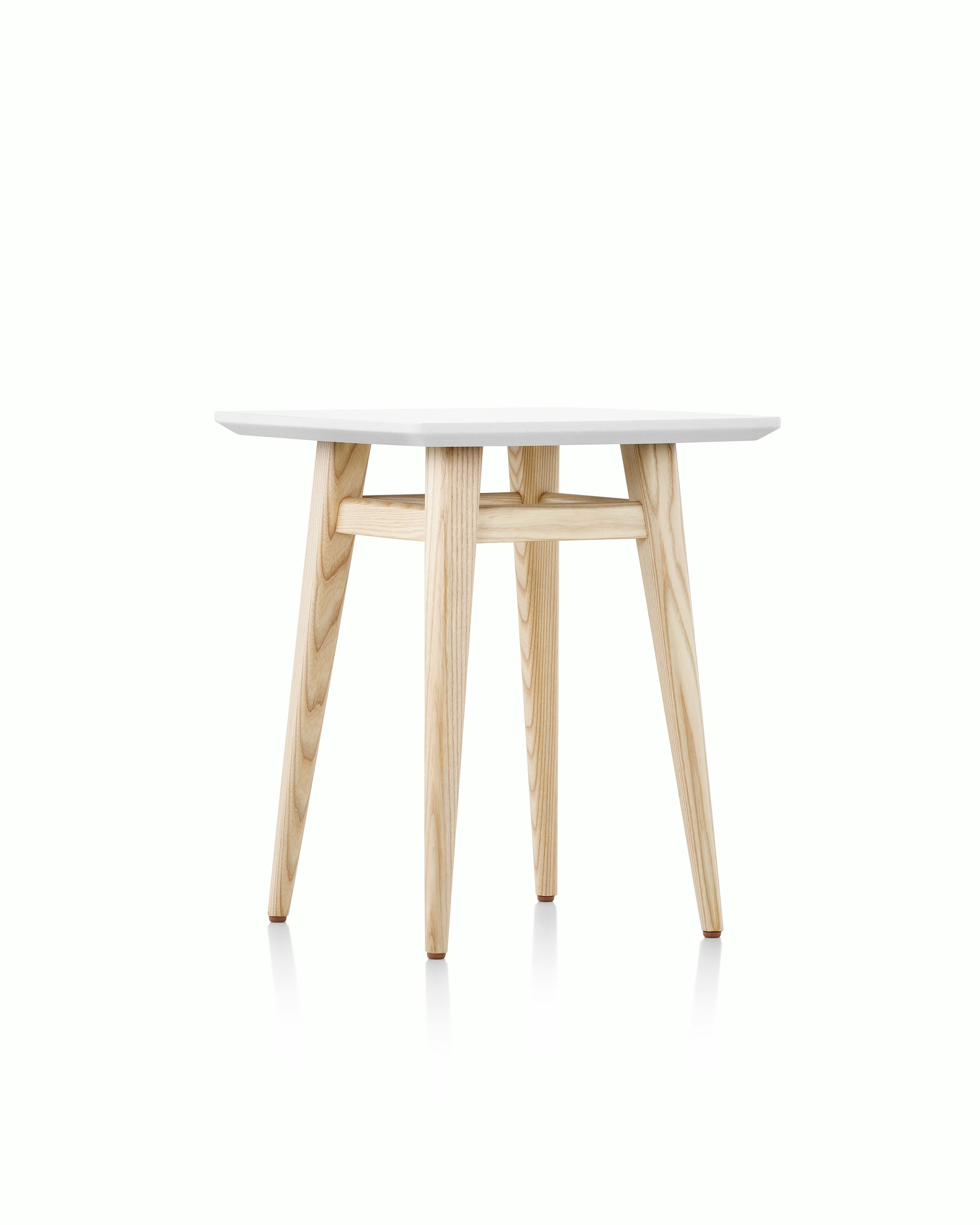 Palisade Occasional Table with wood legs and solid surface top on white sweep.