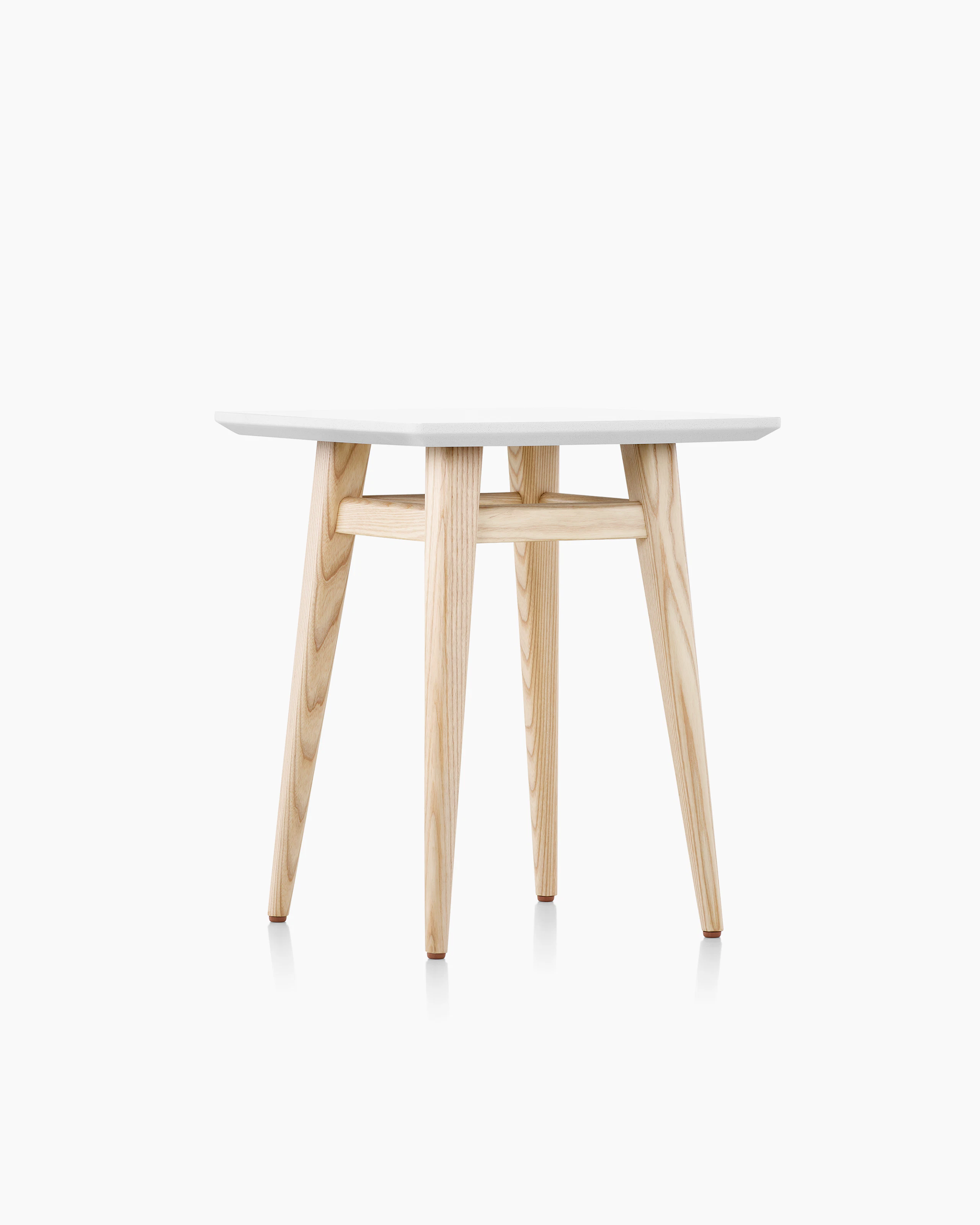 Palisade Occasional Table with wood legs and solid surface top on white sweep.